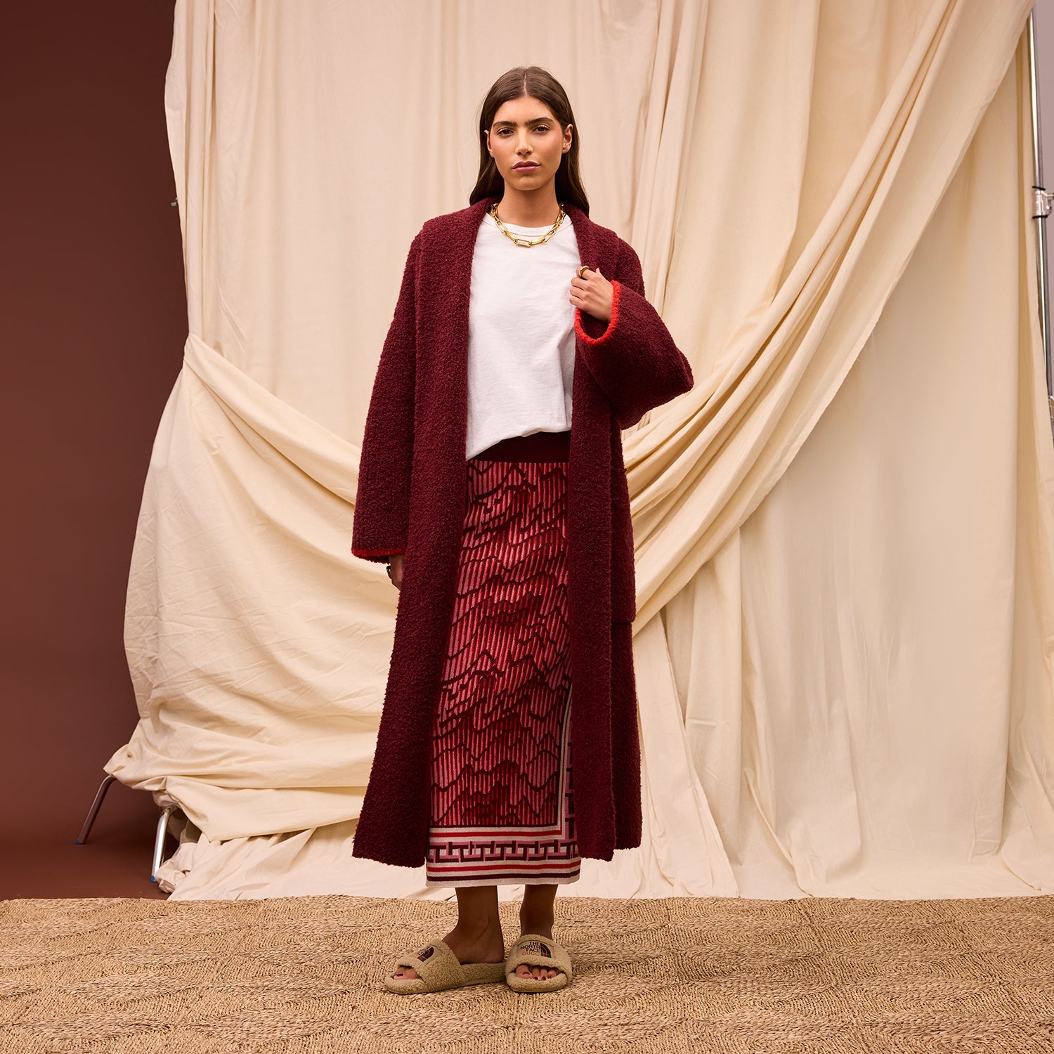 Model wearing burgundy Hanna Knit Maxi Skirt with long cardigan showing full length and styling options