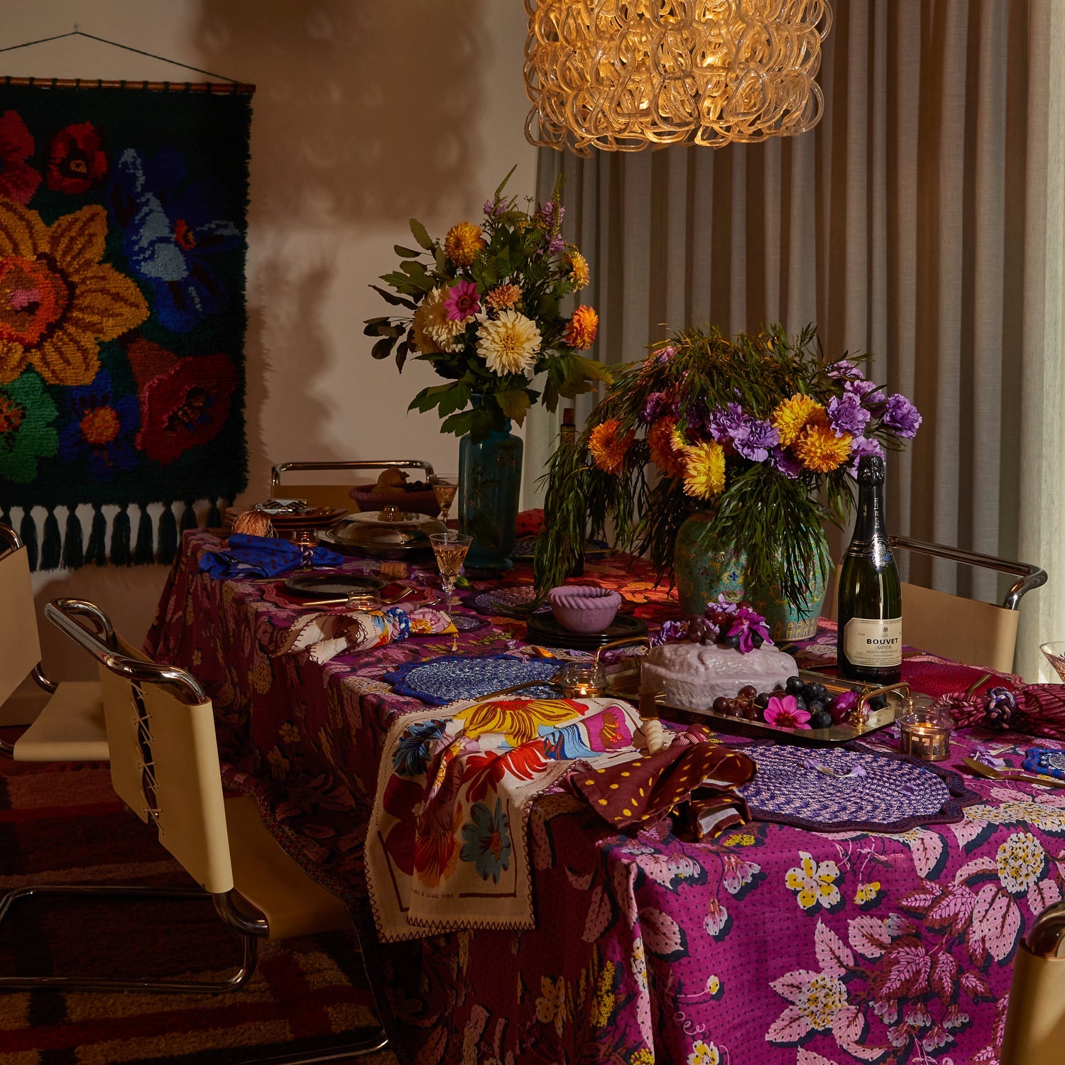 Aerial view of Hanna Pansy napkin set showing colorful floral patterns and zigzag stitched borders on table
