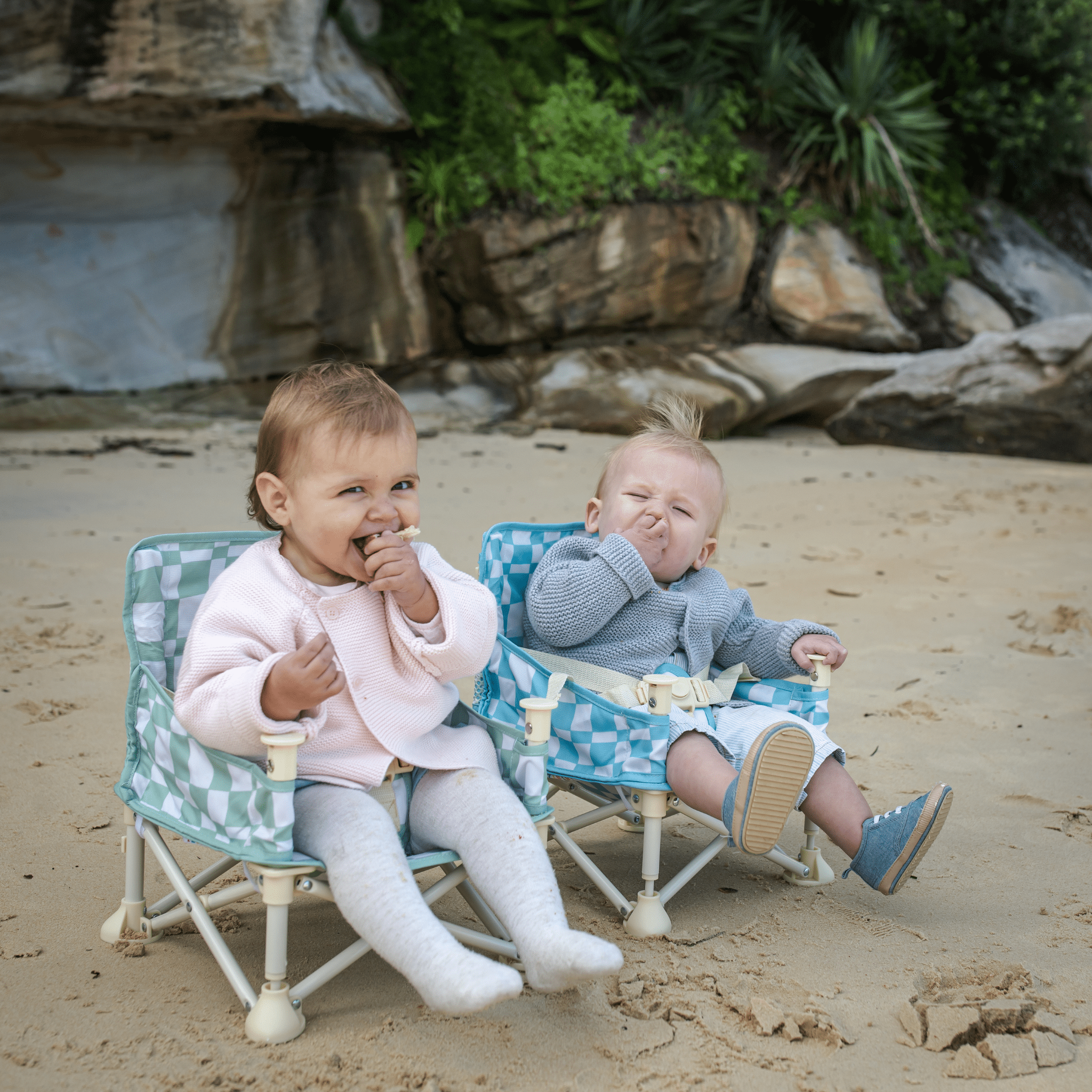 toddlers sitting at the beach in Harper baby chair v2 by IZIMINI portable infant seat