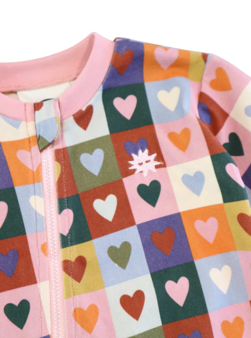 Close up of heart print on the Heart Checkerboard Zip All In One | Kapow Kids