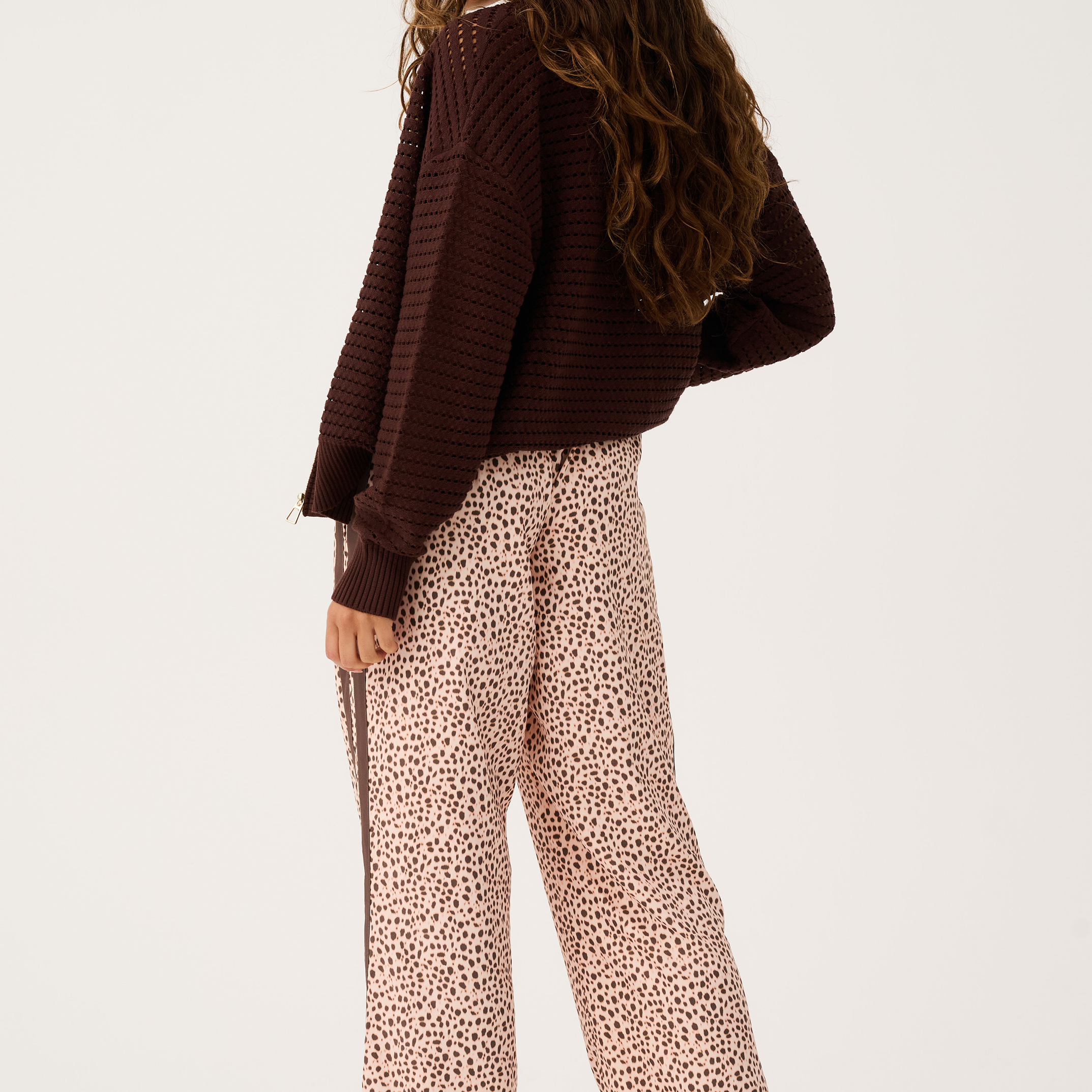 Back view of Heidi Pant in ocelot print showing wide leg silhouette and side stripe detail