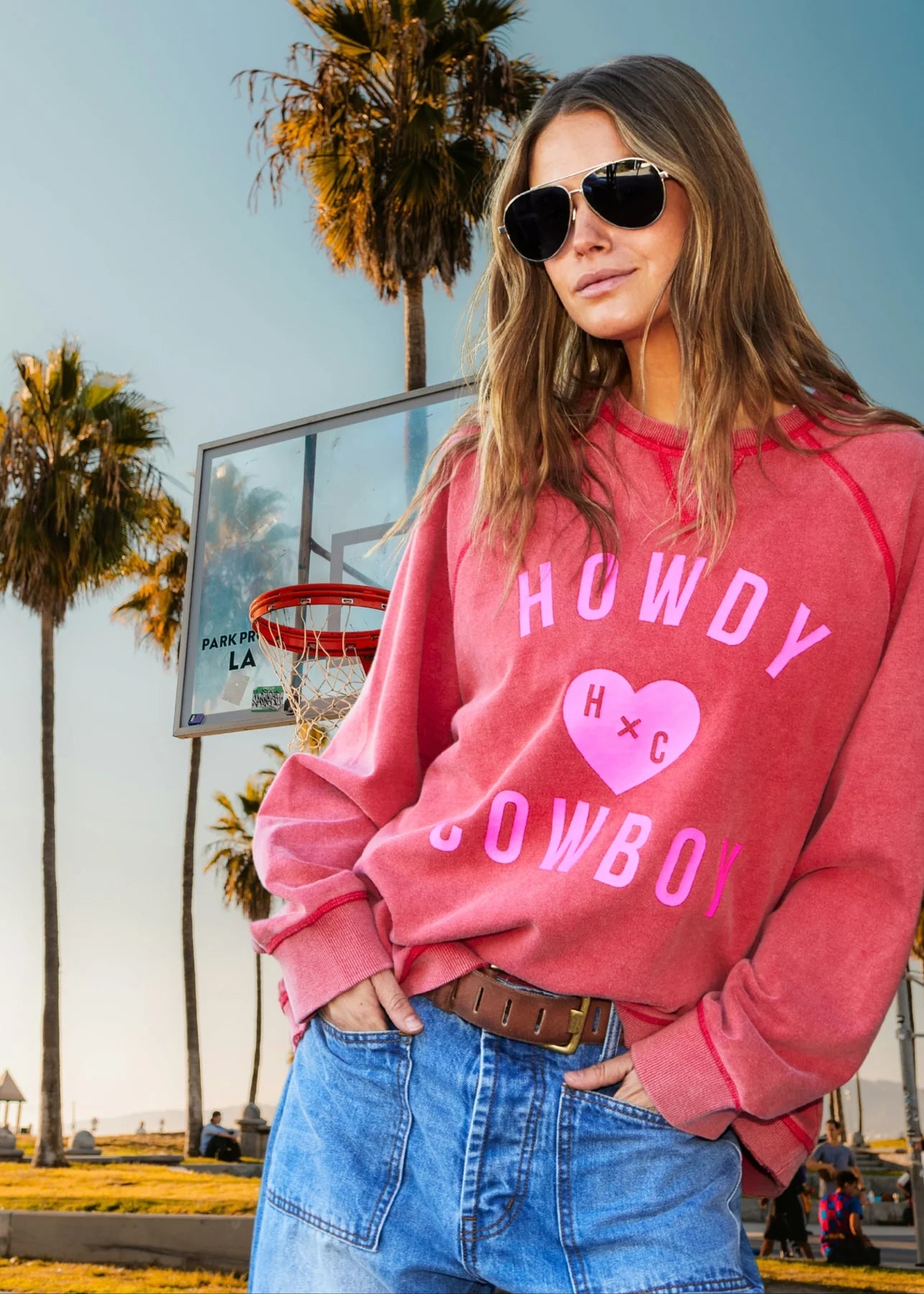 model wearing Howdy Cowboy Vintage wash sweats - Red by Hammill & Co