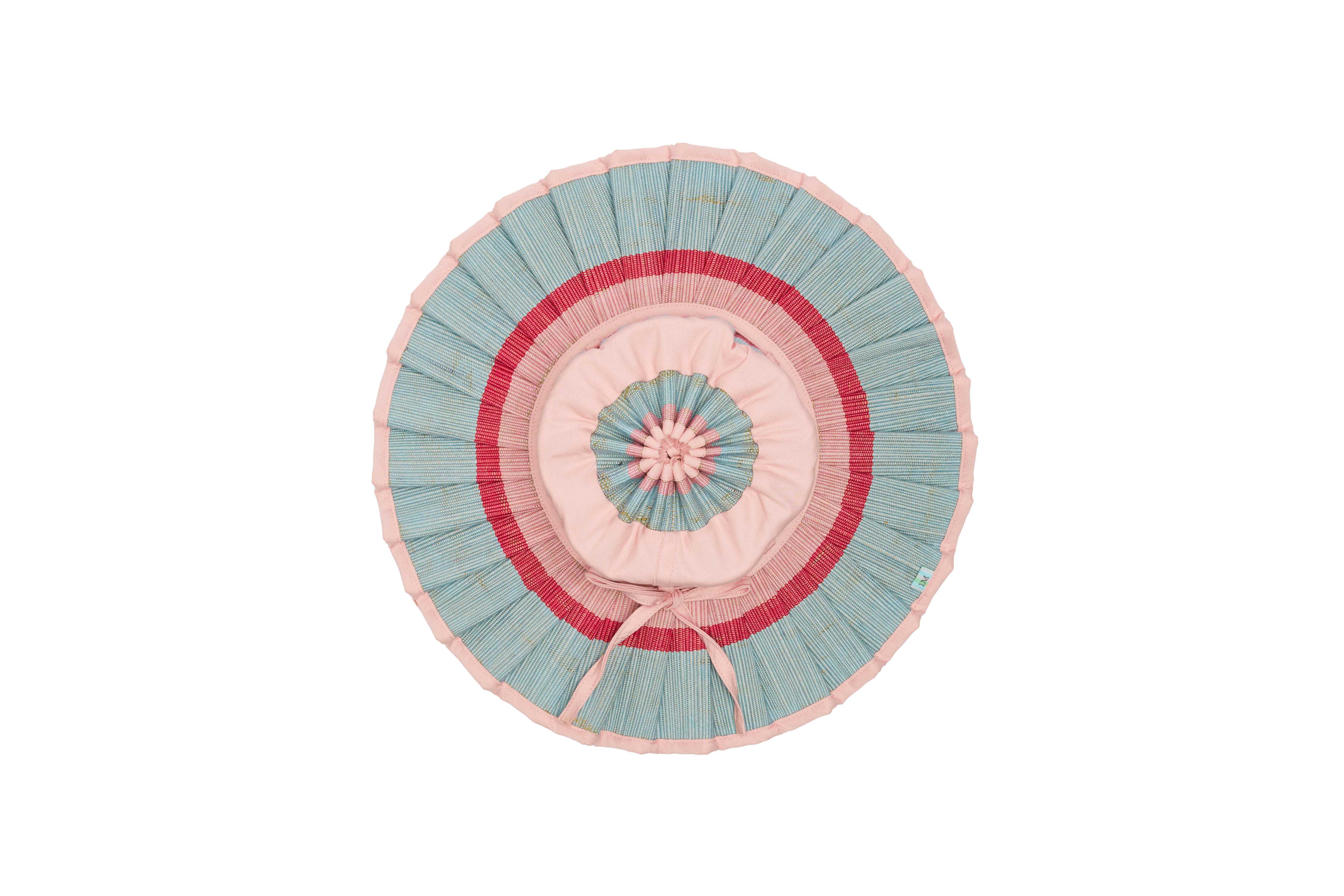 Top view of Lorna Murray Capri Hat displaying circular pleated design and pastel color pattern