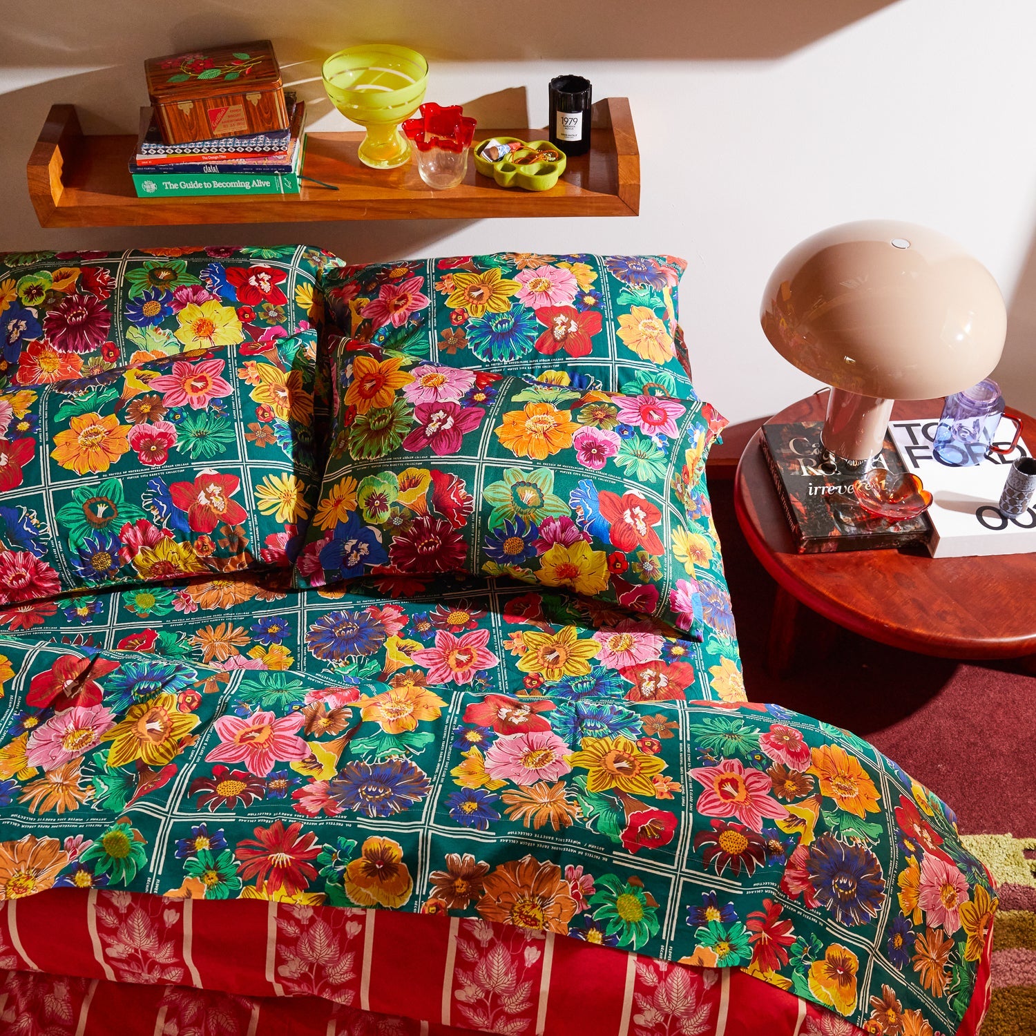 Full bedroom view of Ines Silk Pillowcase Verdant styled with coordinating duvet cover and decor accessories