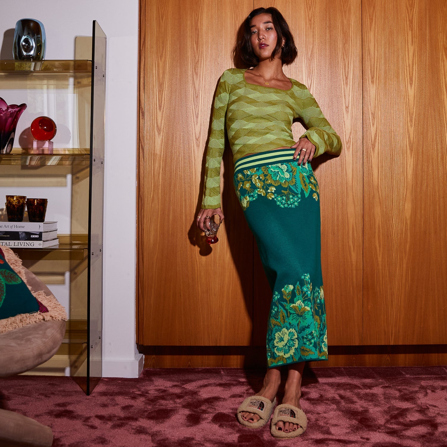 model wearing juniper green merino knit top displaying fitted silhouette and sleeve shape