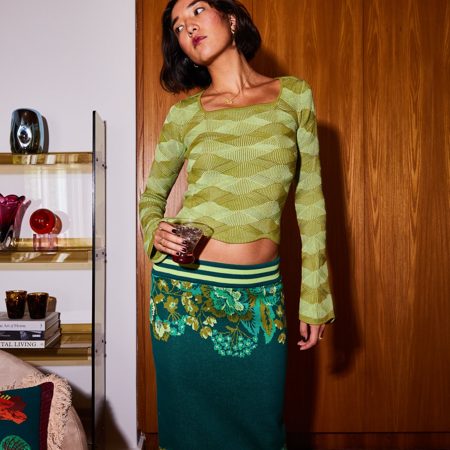 Ingrid knit top styled for layering with accessories showing versatile merino wool design