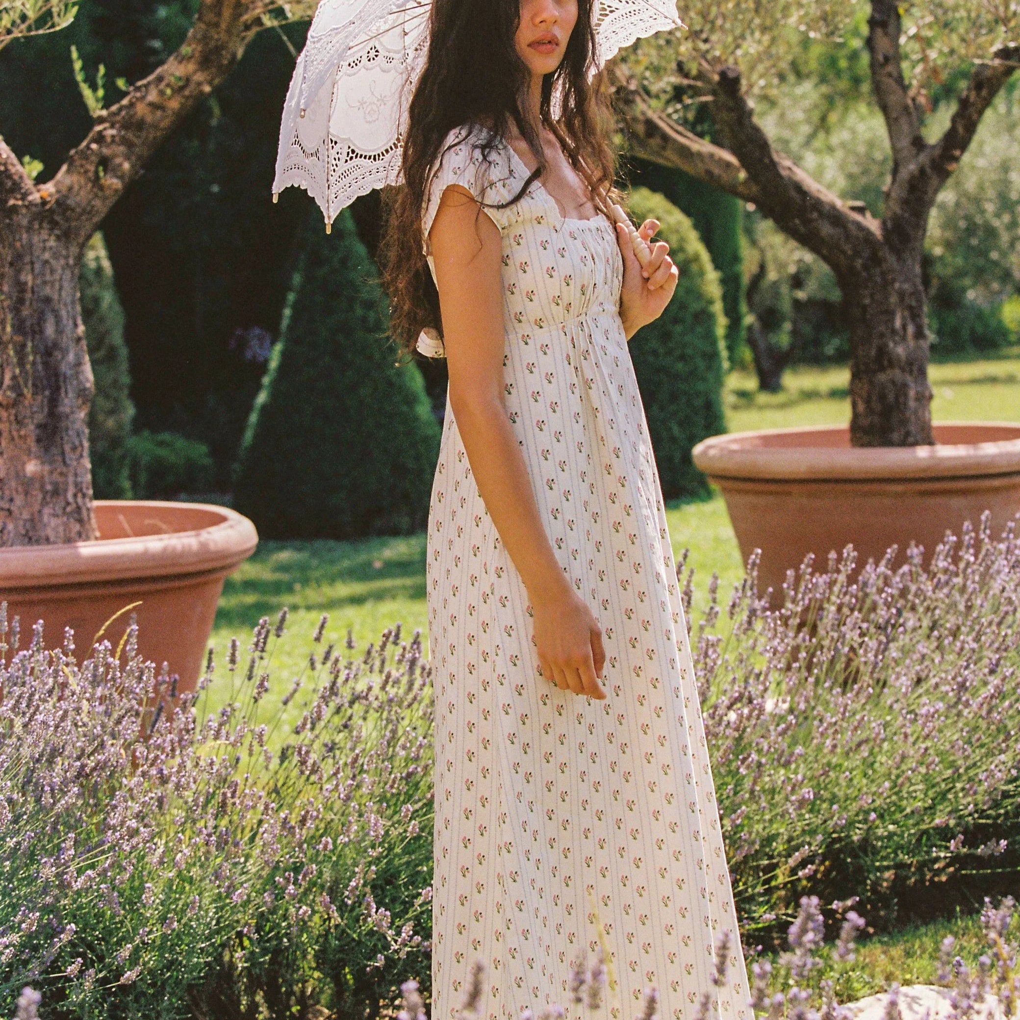 Lady wearing Irina Maxi Dress Poppy Stripe by Juni