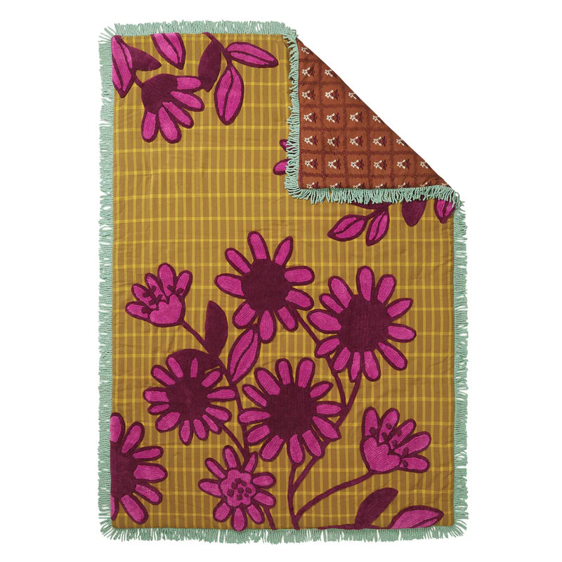 Ismay Tufted Bedcover by Sage & Clare - reversible bed cover with a floral tiled pattern on oneside and khaki & purple floral embroidery on the other side.