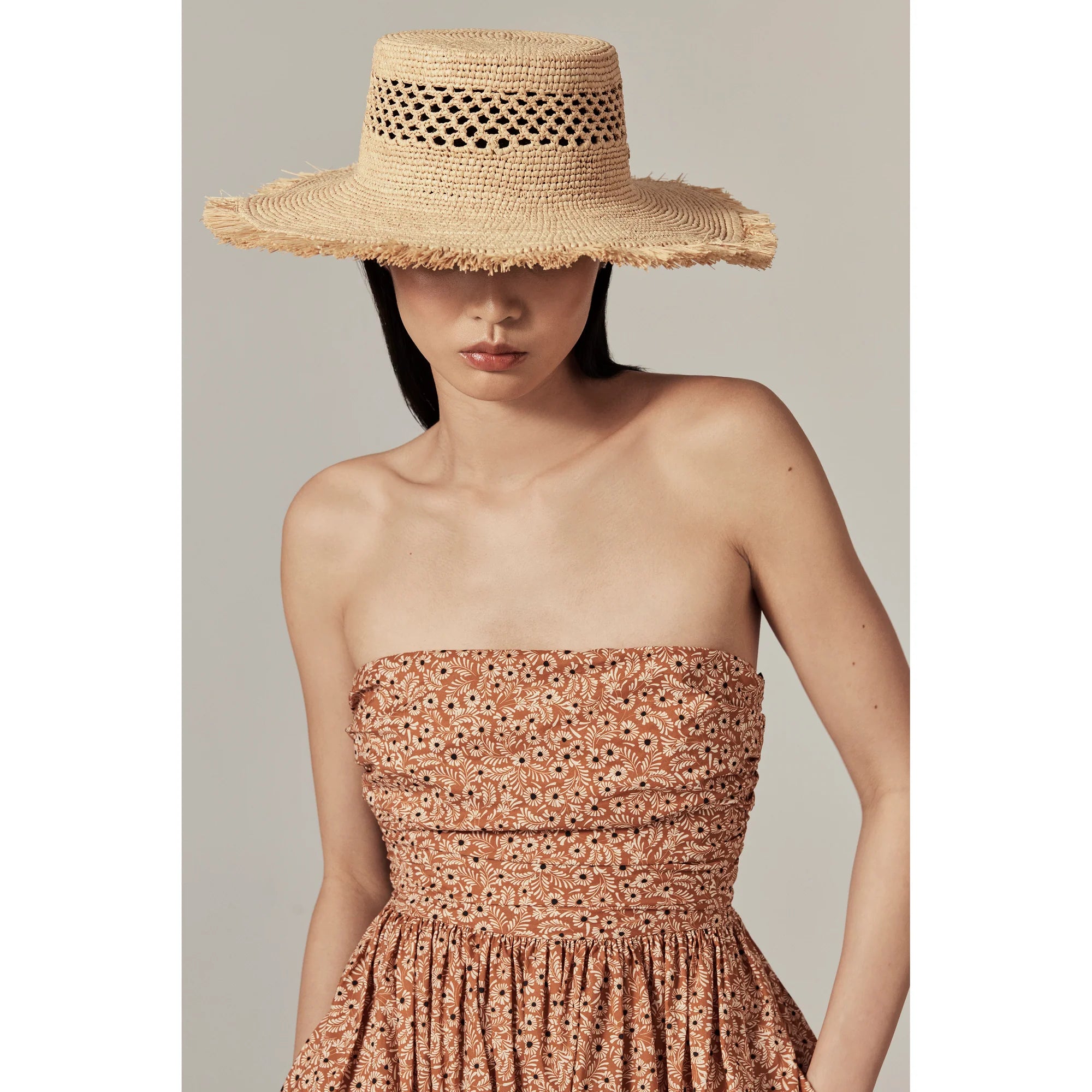 model wearing Ivy Raffia Boater Natural by Helen Kaminski