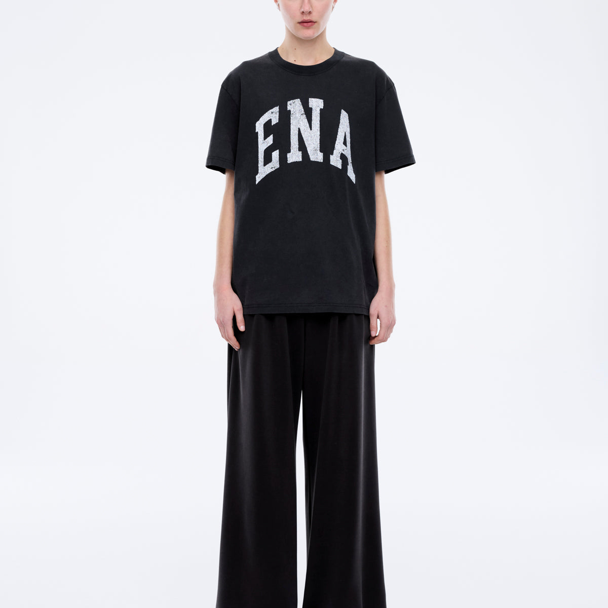 Front view of Jessie oversized collegiate tee in charcoal with white ENA lettering and relaxed fit