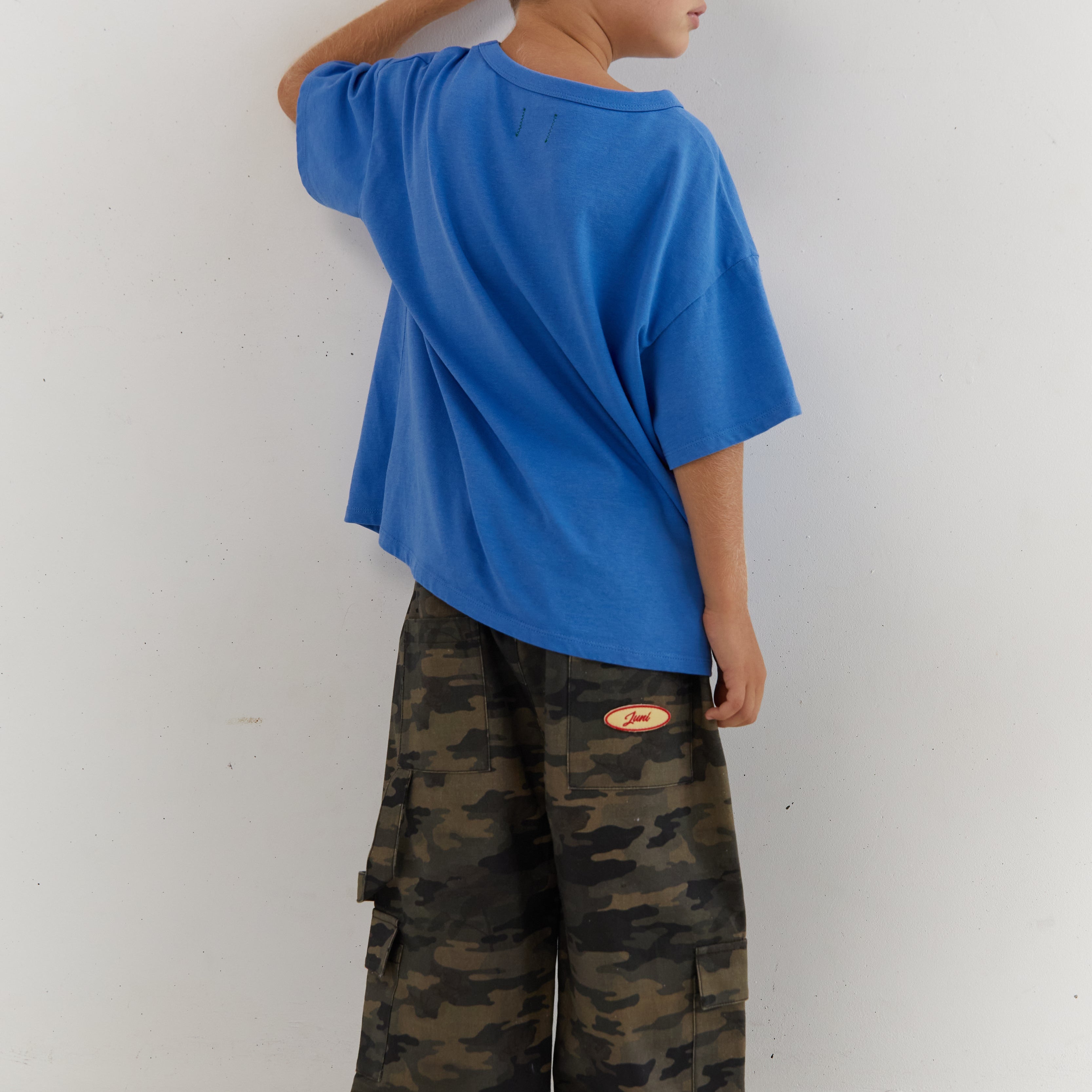Back view of azure blue Star Tee showing plain back and oversized fit