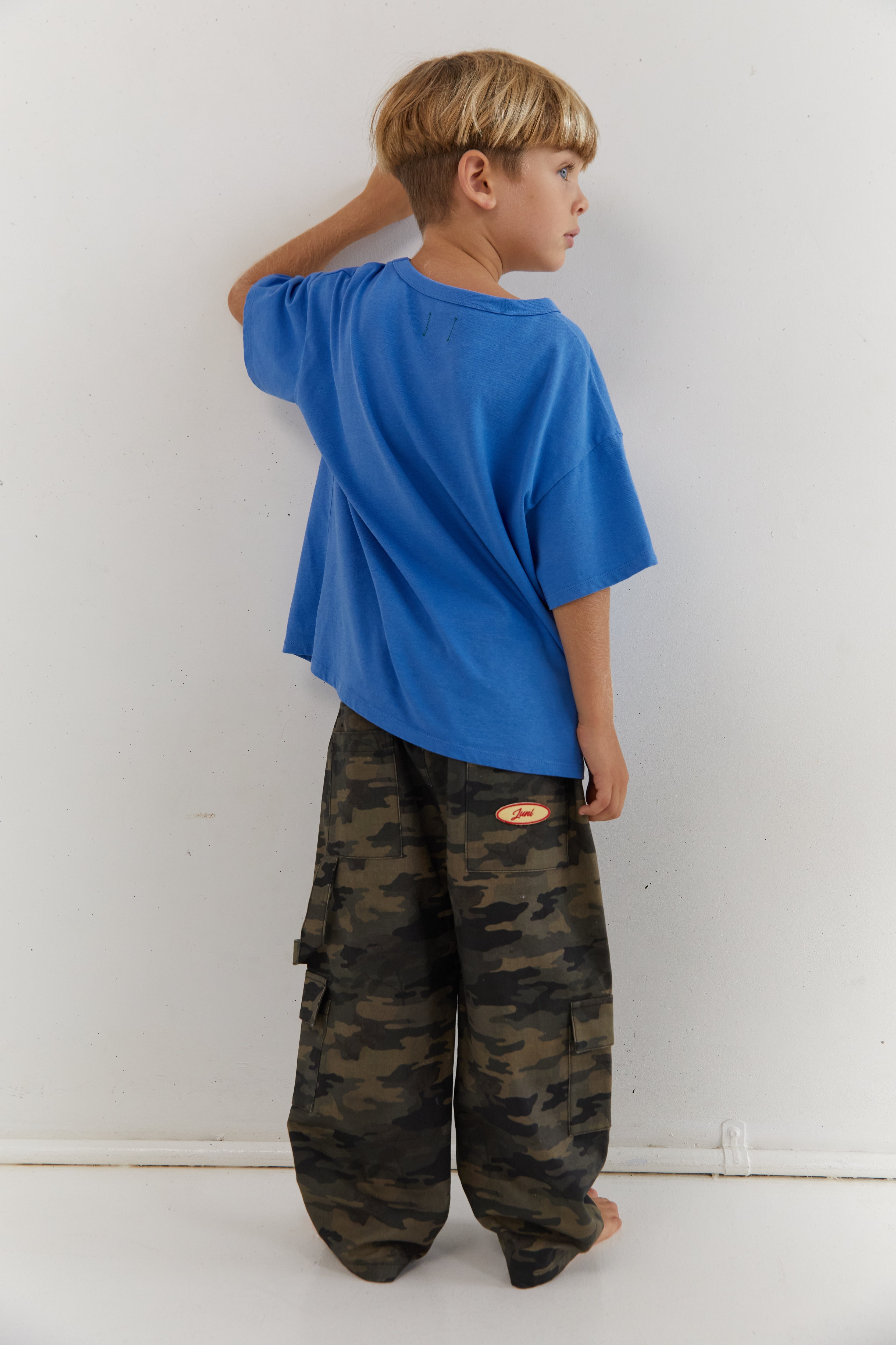 Back view of azure blue Star Tee showing plain back and oversized fit