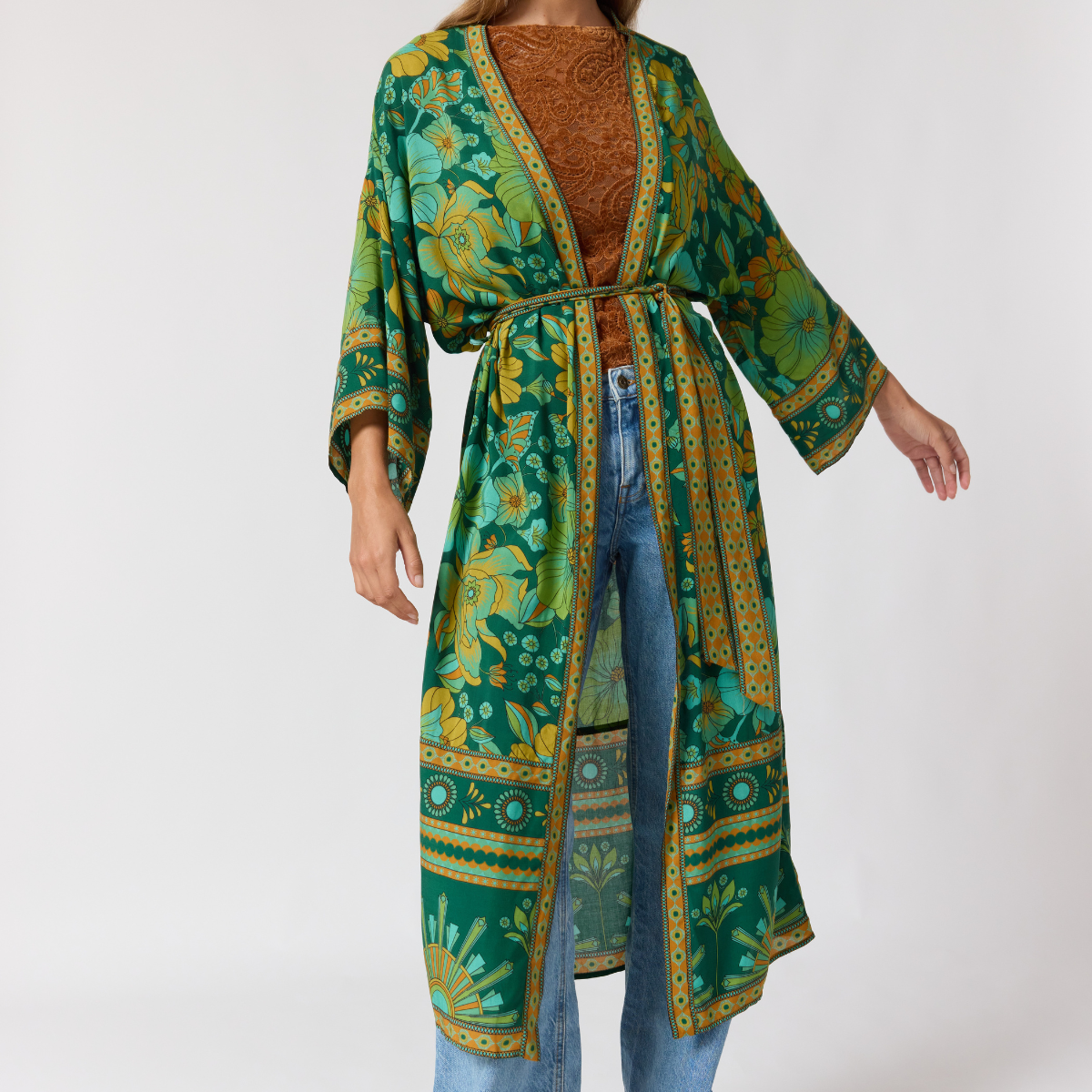 Close up detail of jade robe wide sleeves and contrast border trim