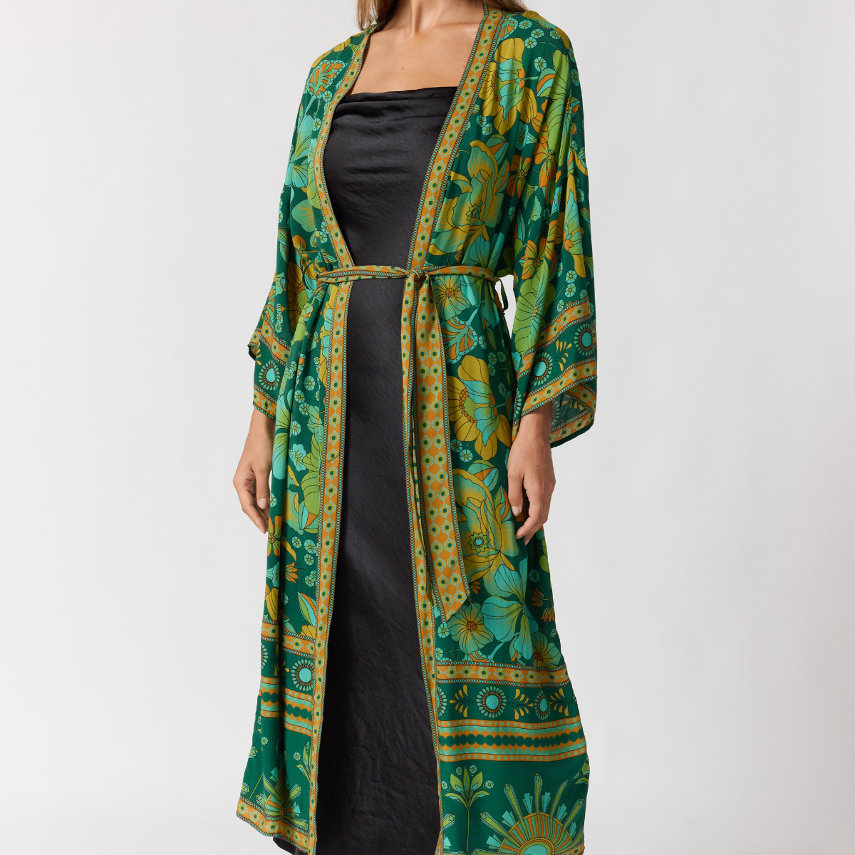 Nine Lives Bazaar emerald robe styled over dress