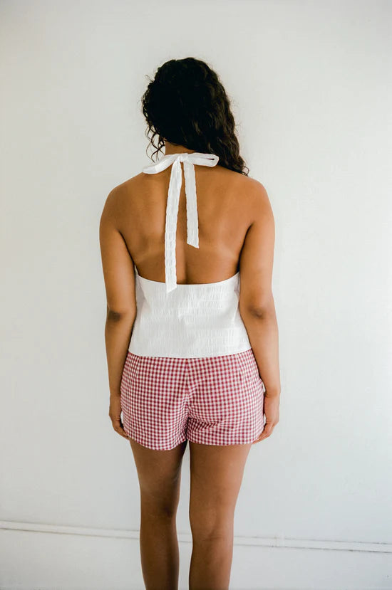 red and white check shorts by juni