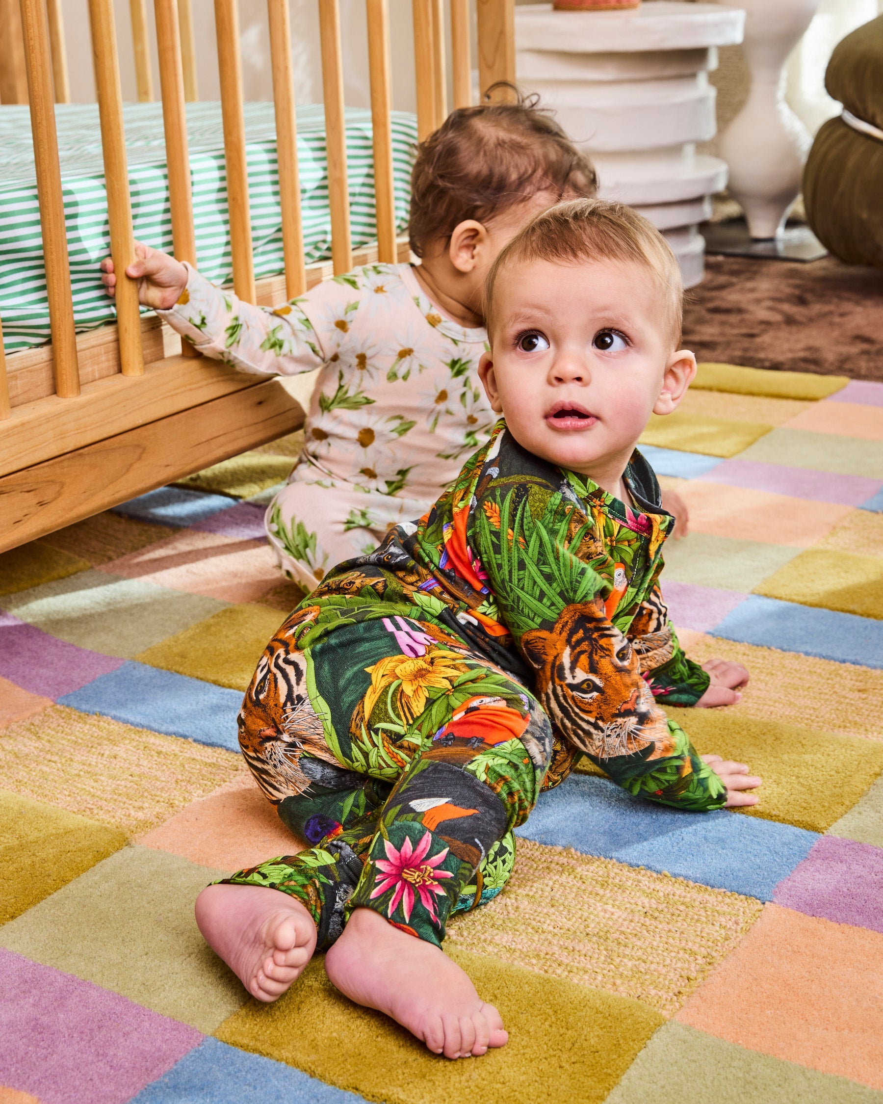 Full length view of Jungle Life zip romper showing long sleeve coverage design
