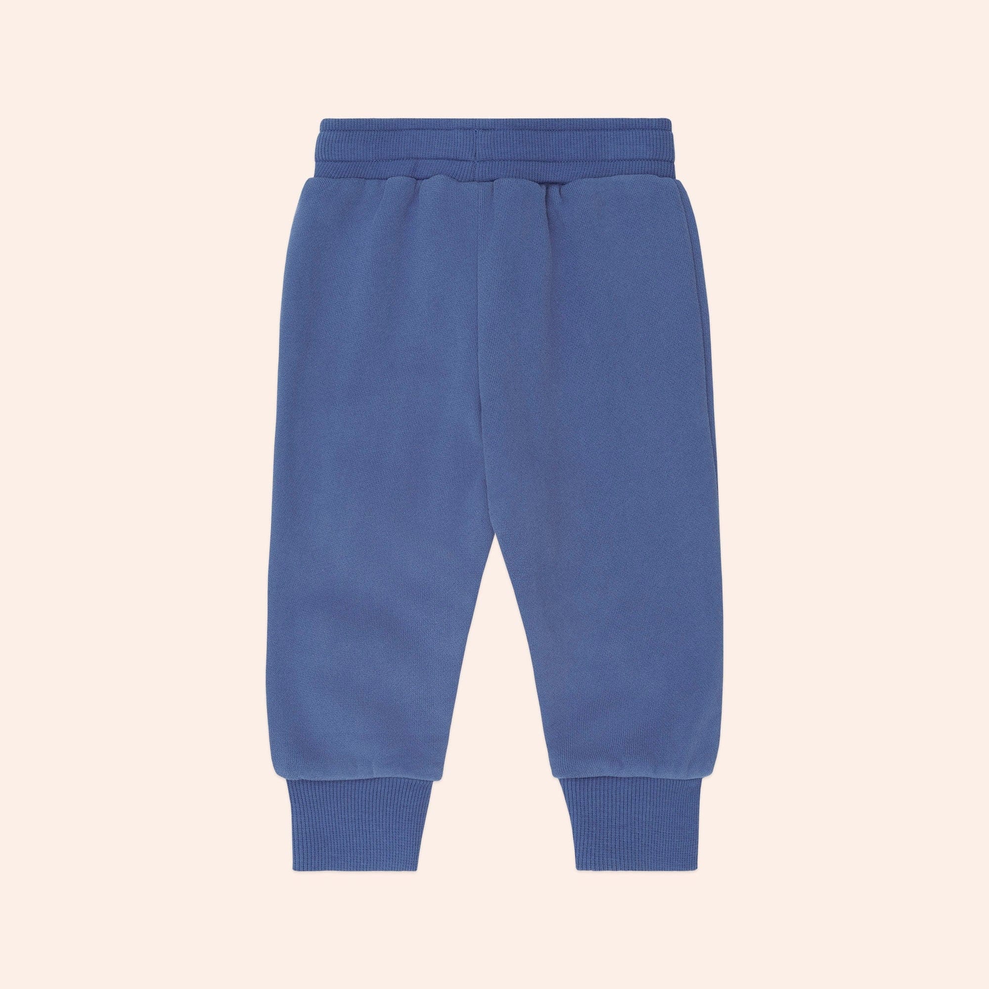 Back view of blue Huxbaby Kel Koala Trackpant showing ribbed cuffs and elastic waistband