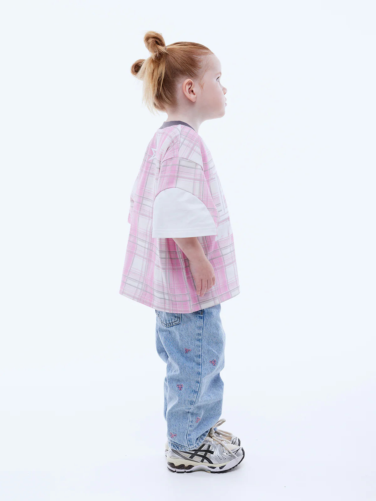 Side view of girl wearing Kids Lunar Jersey by Ena Pelly