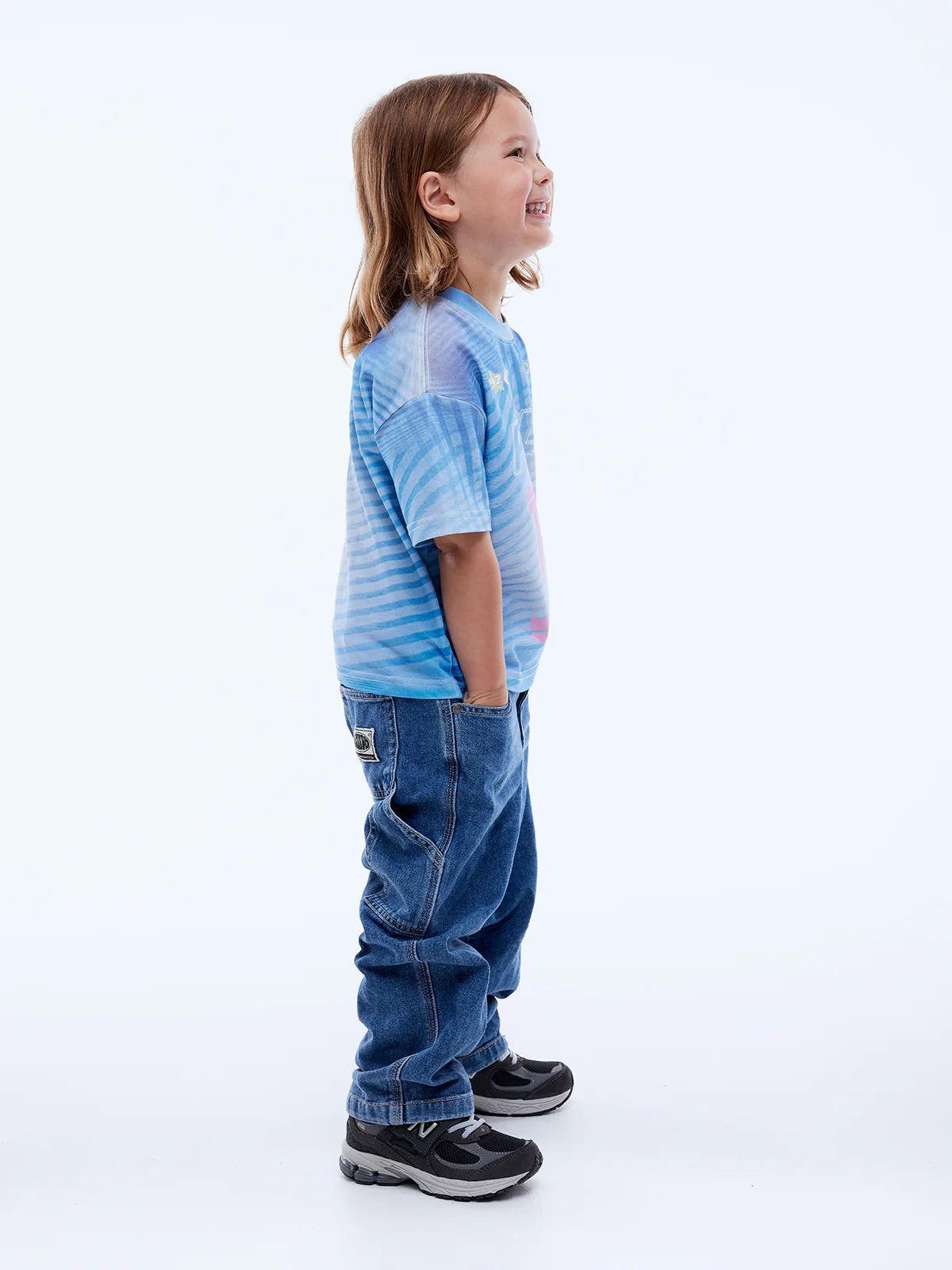 side view of child wearing Kids Solar Tee by Ena Pelly