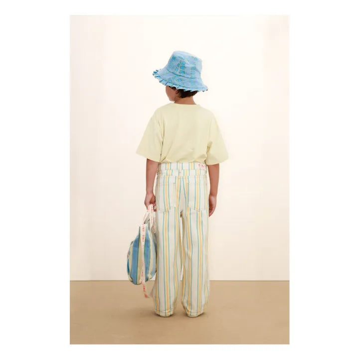 Back view of child wearing Tiny Dog Graphic Tee - Dusty Yellow