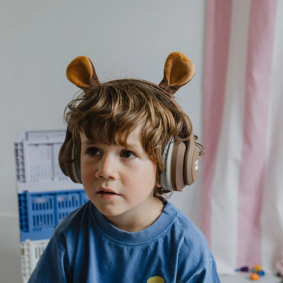 child wearing Kidyears Bear headphones by Kidywolf