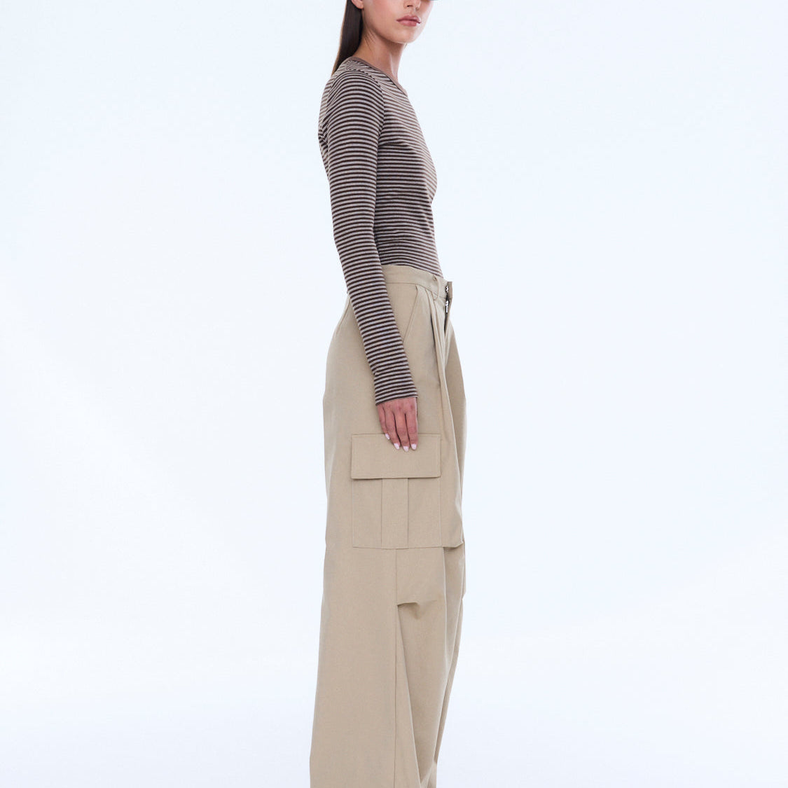Side profile view of Lainey Cargo Pant in sand displaying wide leg fit and cargo pocket placement