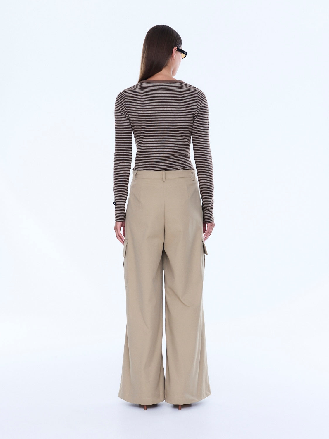 Back view of Lainey Cargo Pant in sand showing wide leg silhouette and rear waistband detail