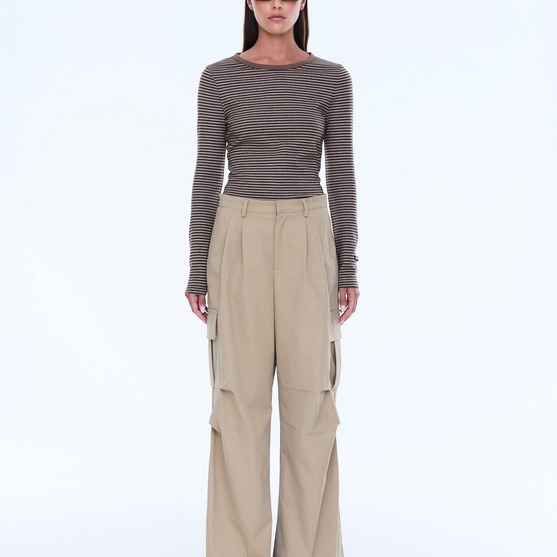 Full front view of Lainey Cargo Pant in sand with wide leg cut and distinctive cargo pocket design