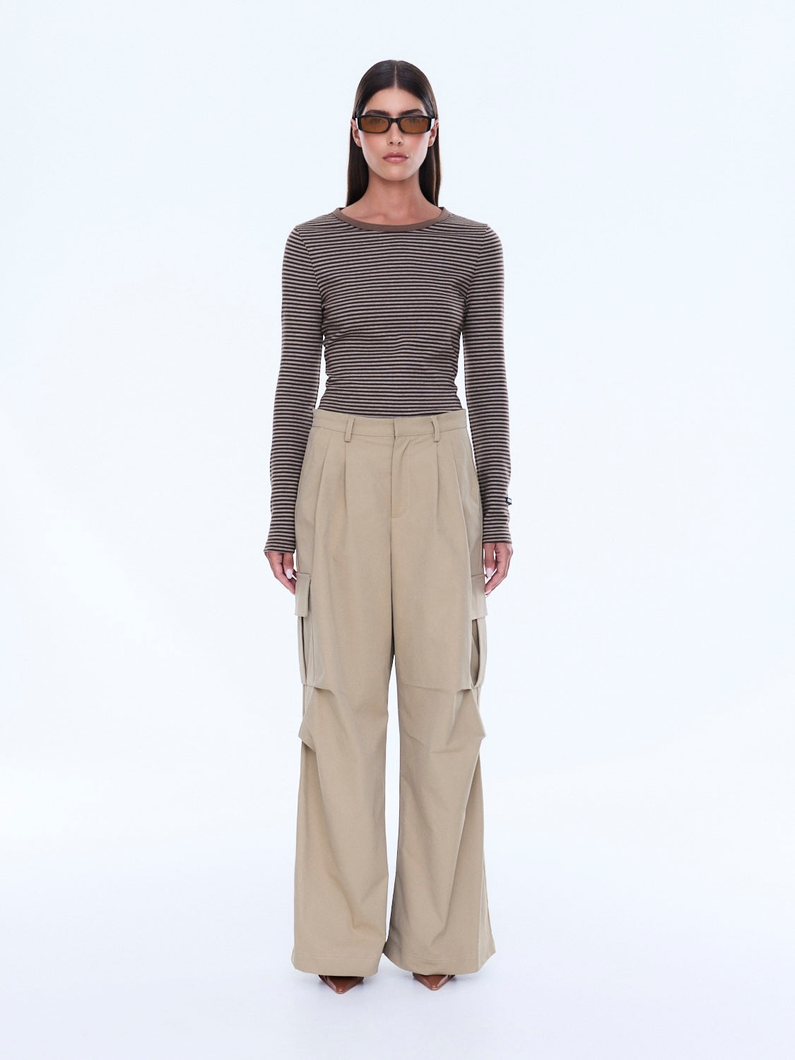 Full front view of Lainey Cargo Pant in sand with wide leg cut and distinctive cargo pocket design