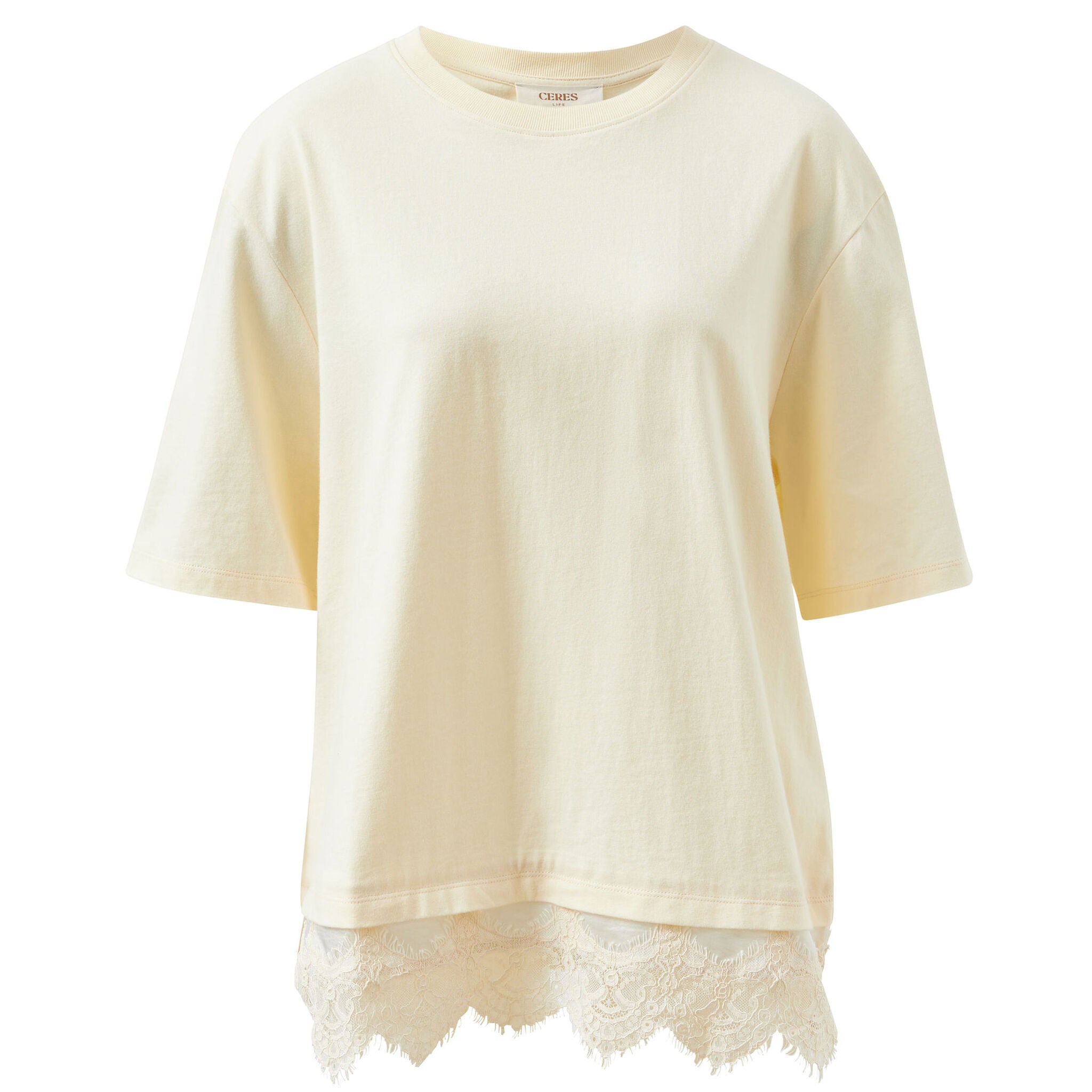 Flat lay of Lacey Tee showing marshmallow cream color with white lace trim hemline