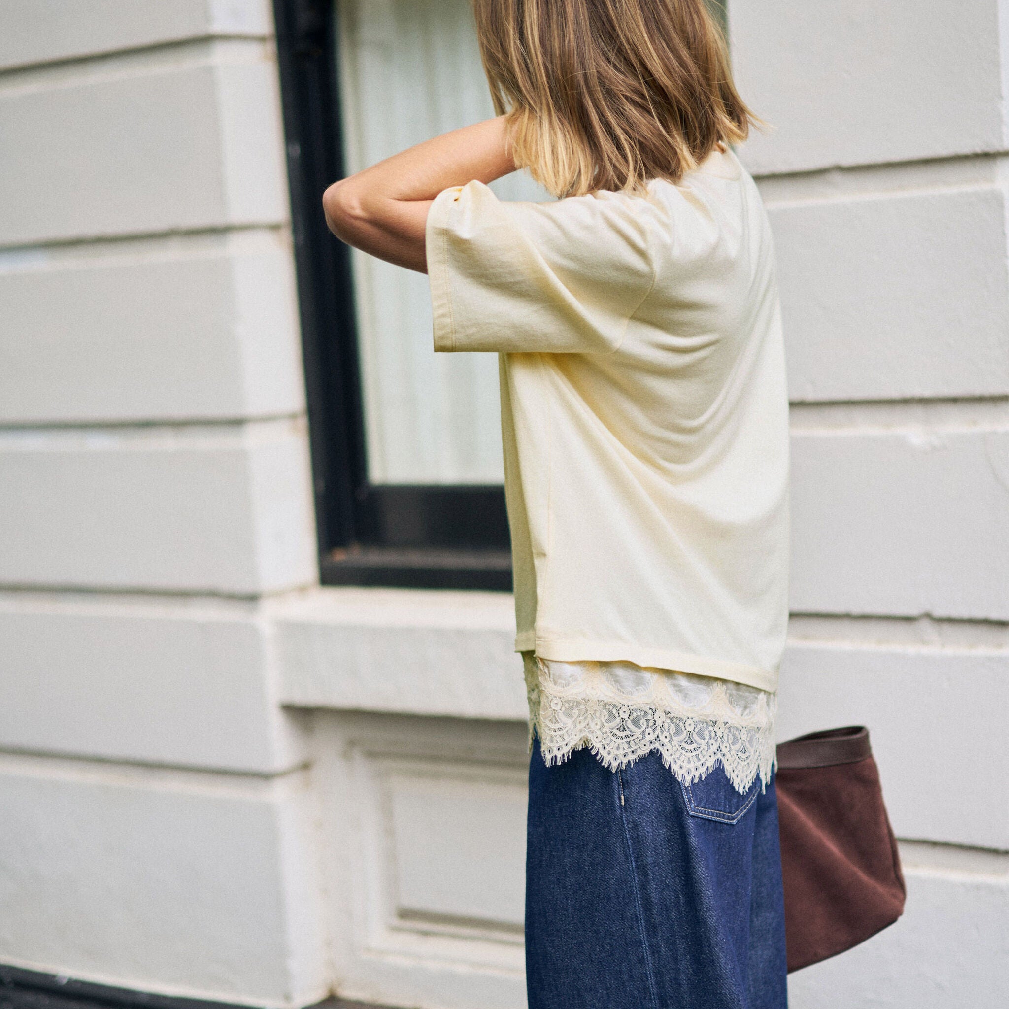 Side angle view of Lacey Tee showing relaxed fit and oversized silhouette