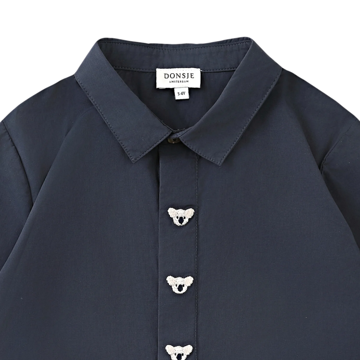 Lauden Shirt with koala embroidery detail by Donsje. In dark blue colour. Made from cotton. Ethical and sustainable brand.