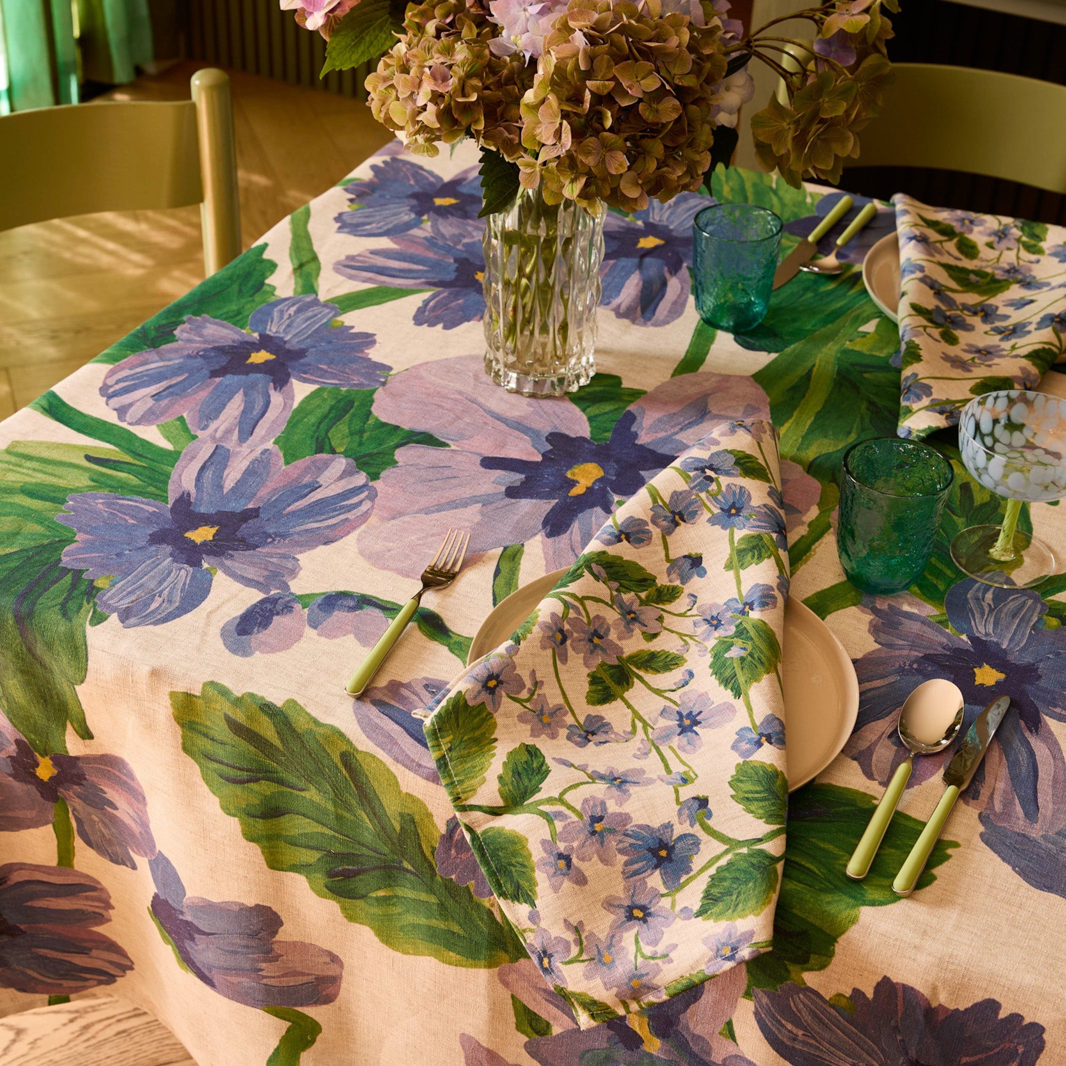 Full dining room view showing Lilas Blue floral napkins set of 4 with botanical print design