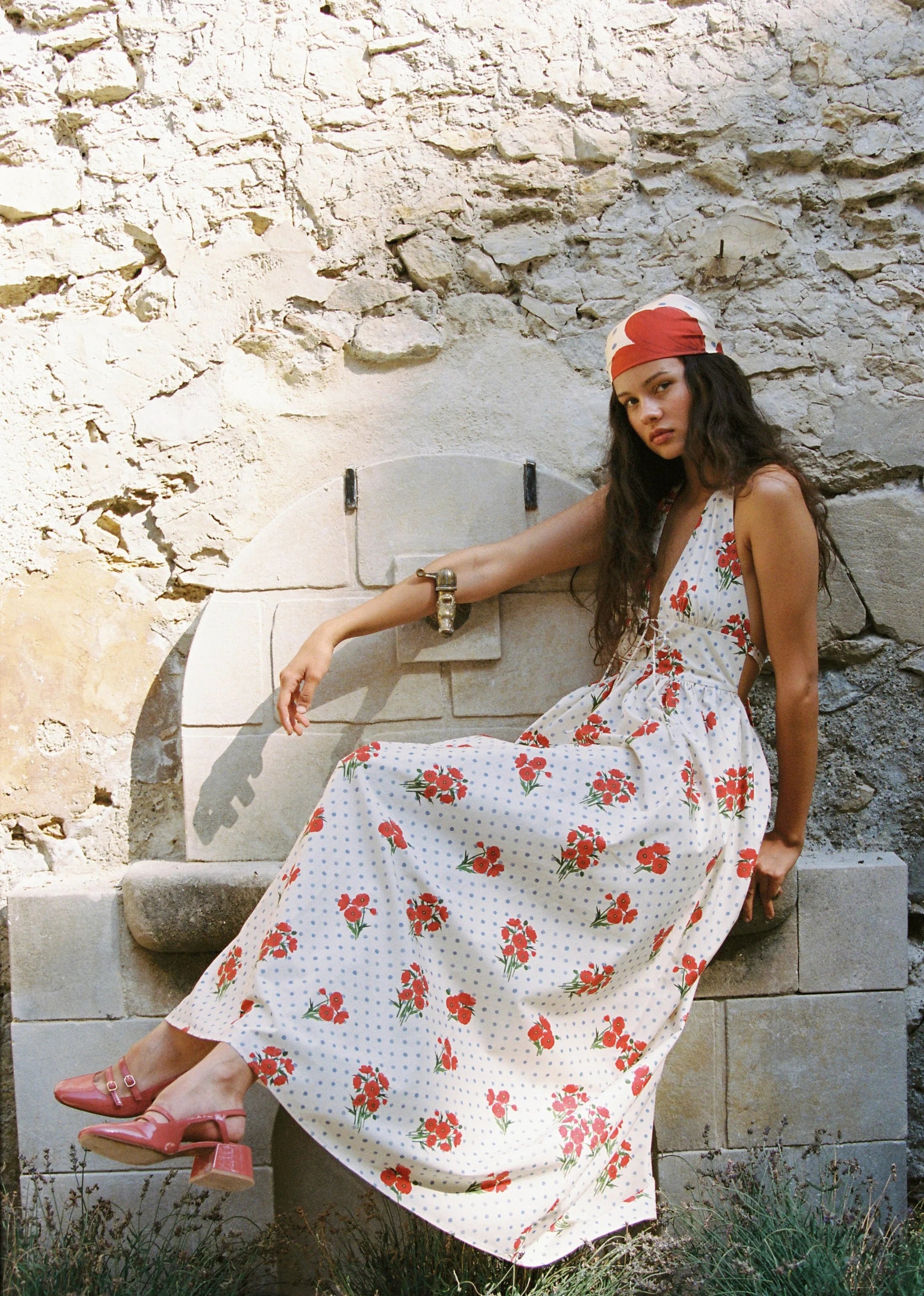 modelling sitting down wearing the Lily Maxi Dress Poppies by JUNI