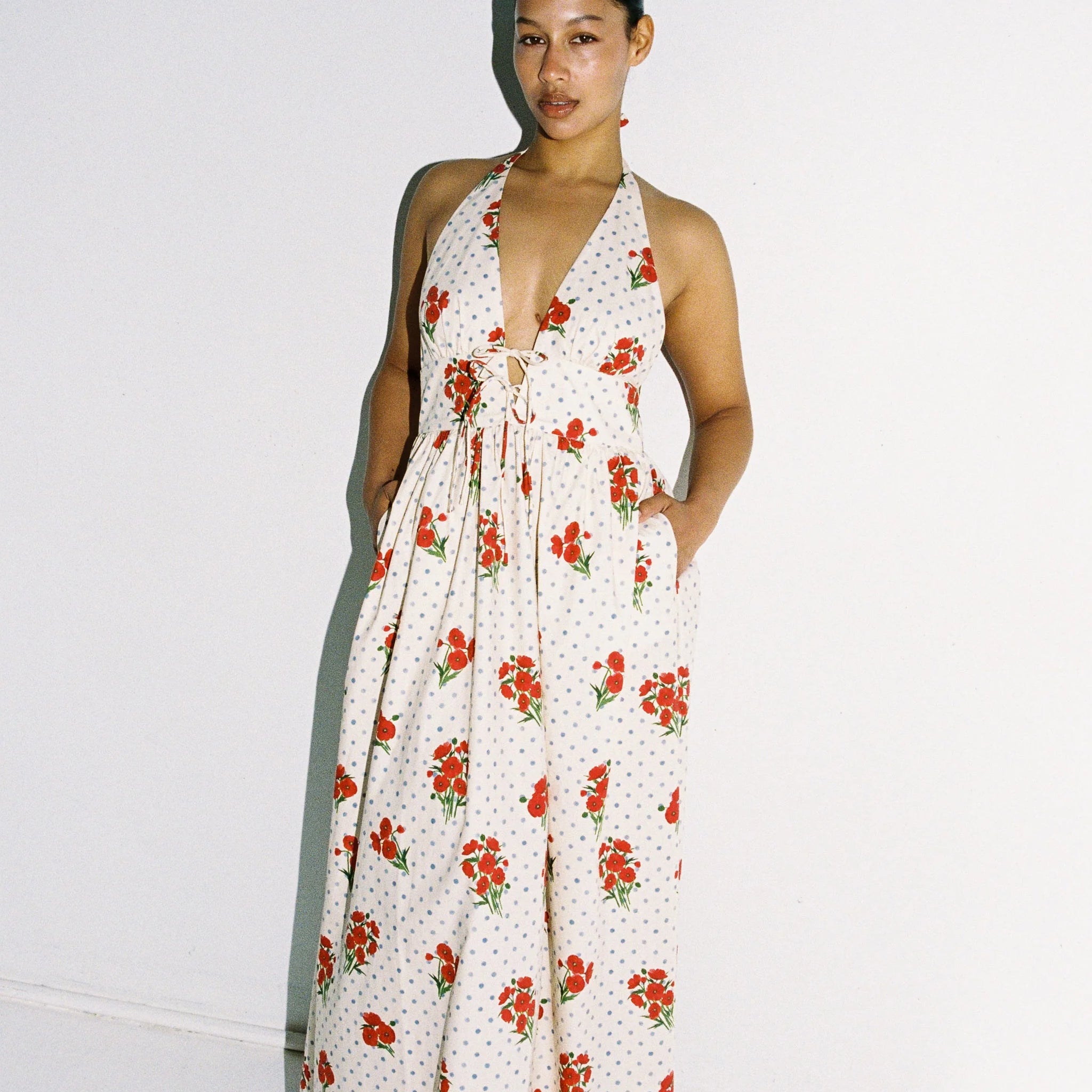 Lady wearing maxi dress with blue polka dots and red flowers - 100% cotton