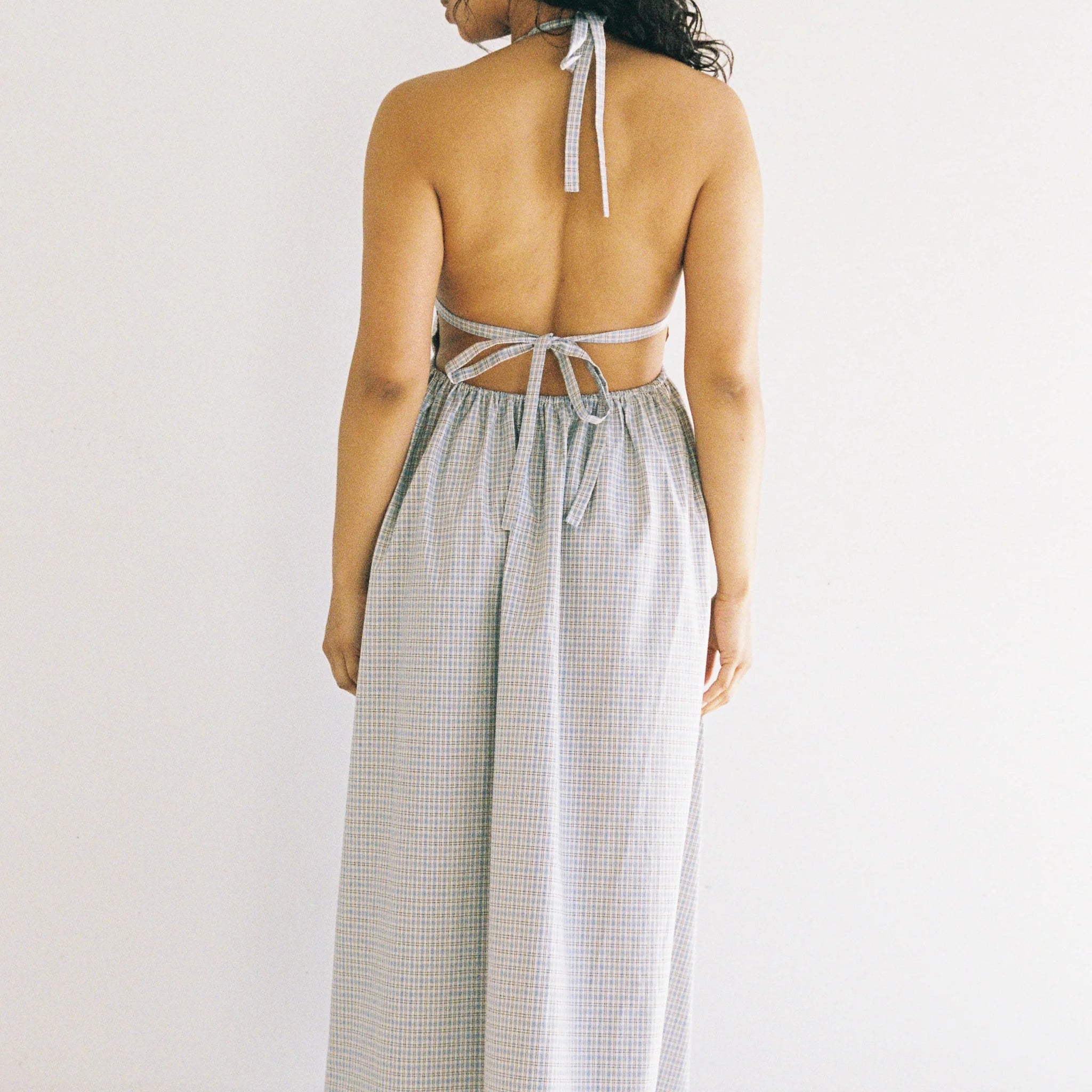 women wearing the Lily midi dress blue check by JUNI