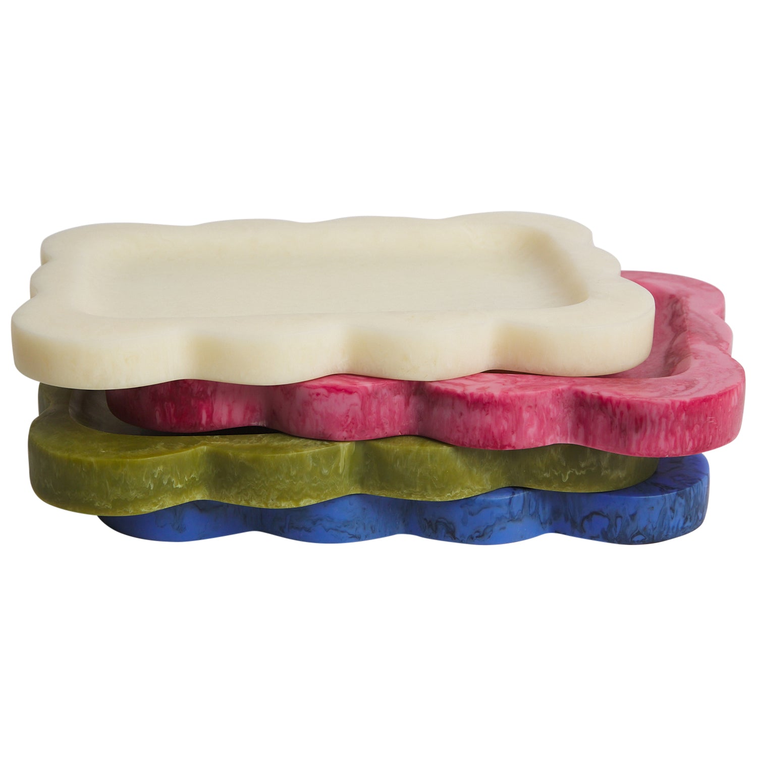 Close-up overhead view of yellow marbled resin scalloped tray holding glasses lipstick and jewelry