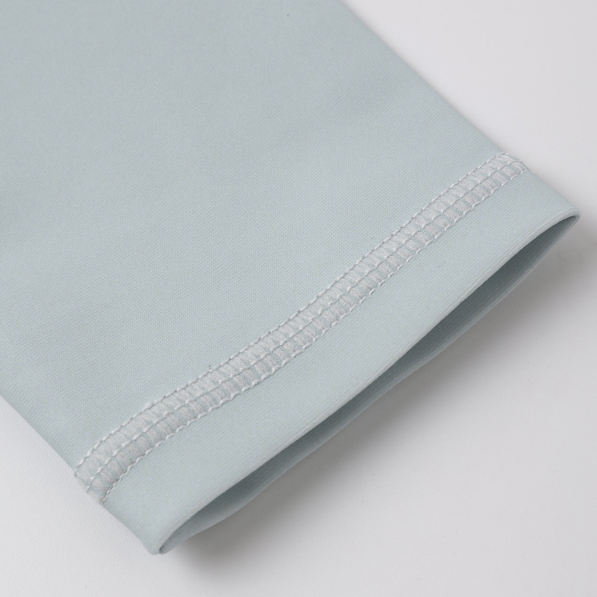 Close up of sleeve on the Long Sleeve Rashguard Seafoam | Rylee + Cru