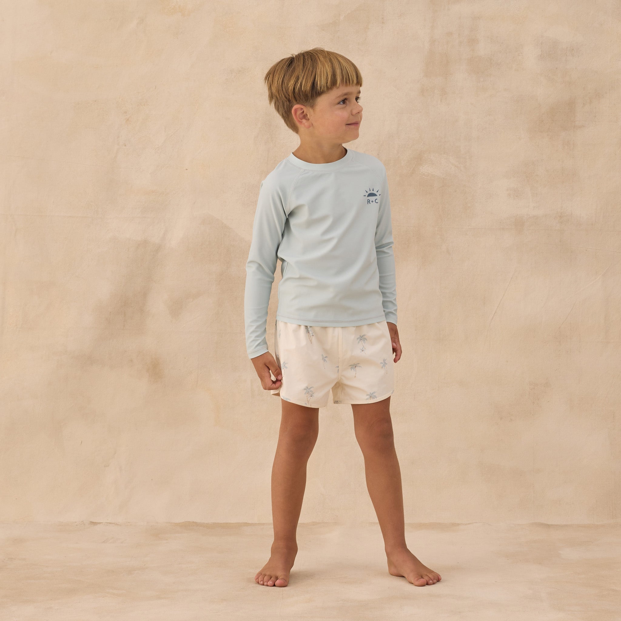 Boy wearing Long Sleeve Rashguard Seafoam | Rylee + Cru