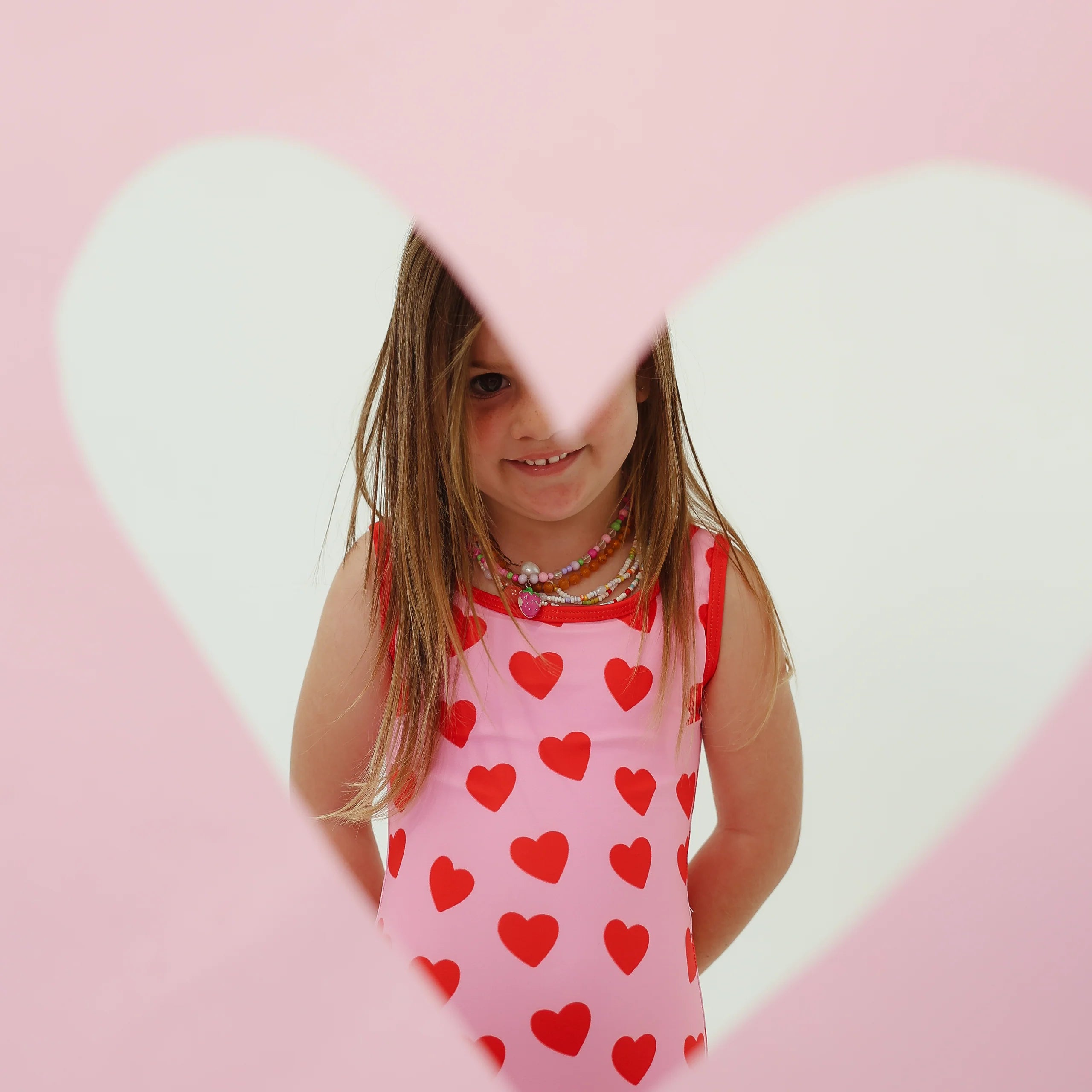 girls one piece pink swimsuit with red hearts By Billie