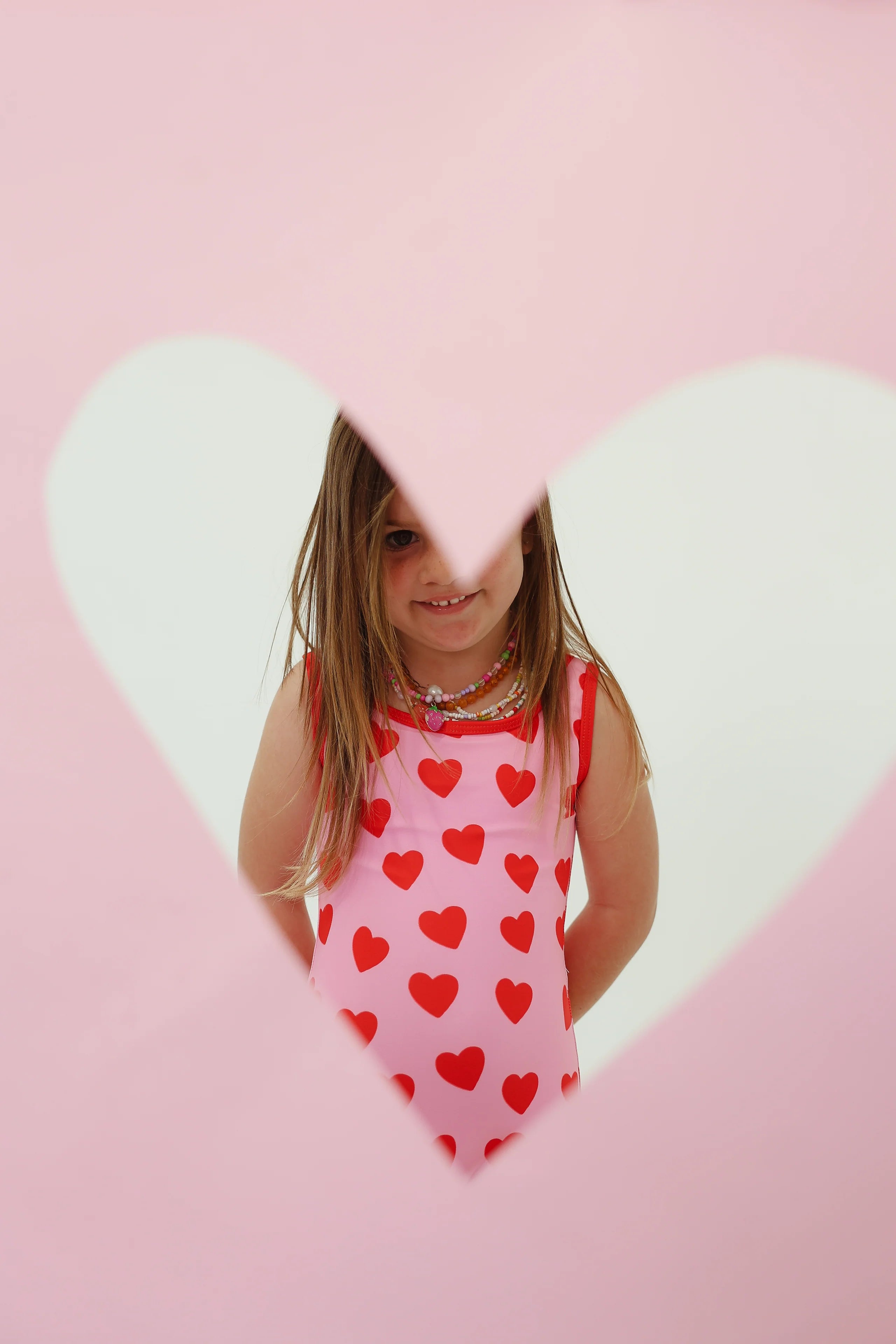 girls one piece pink swimsuit with red hearts By Billie