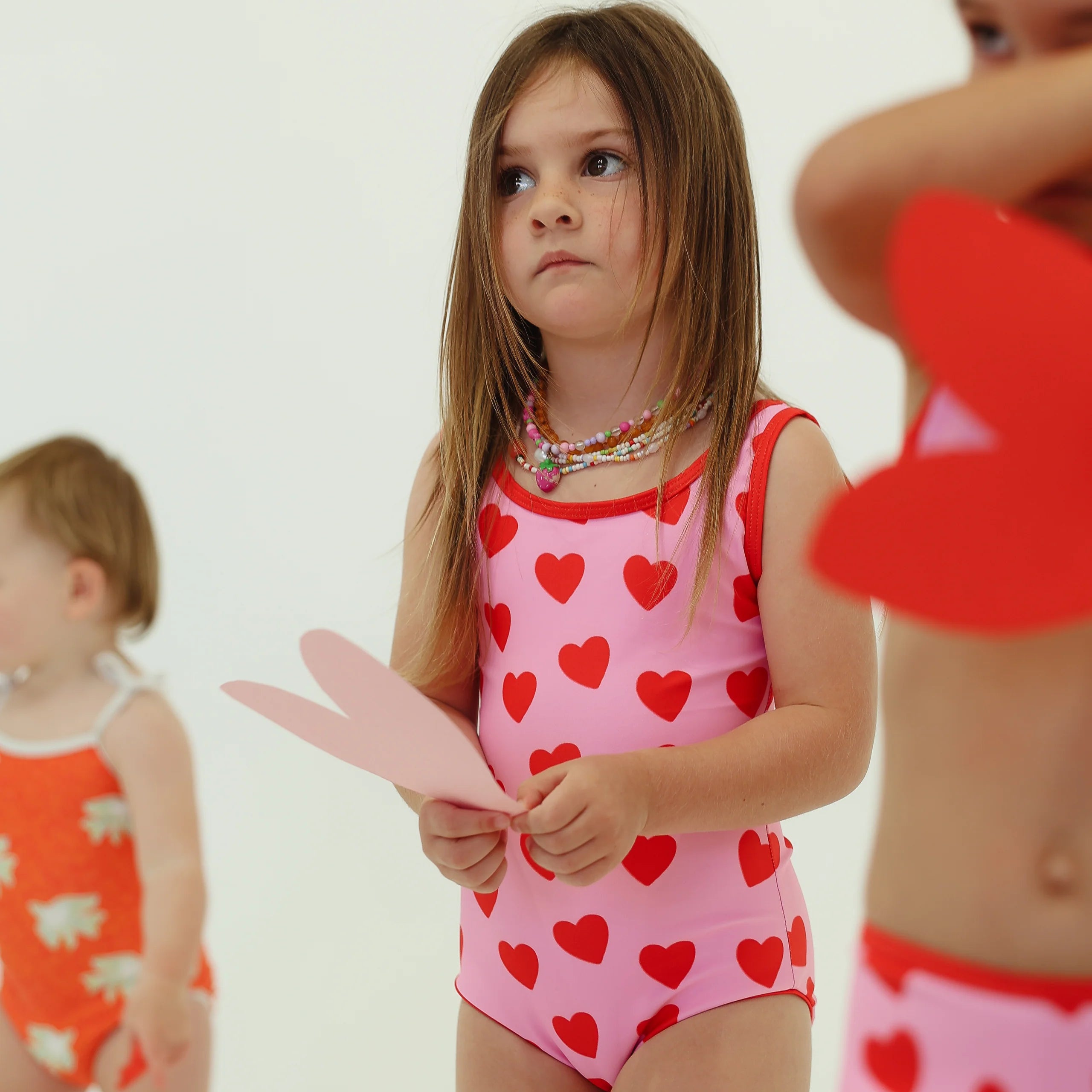 girls one piece swimsuit by By Billie - 'Love You' - pink with red hearts
