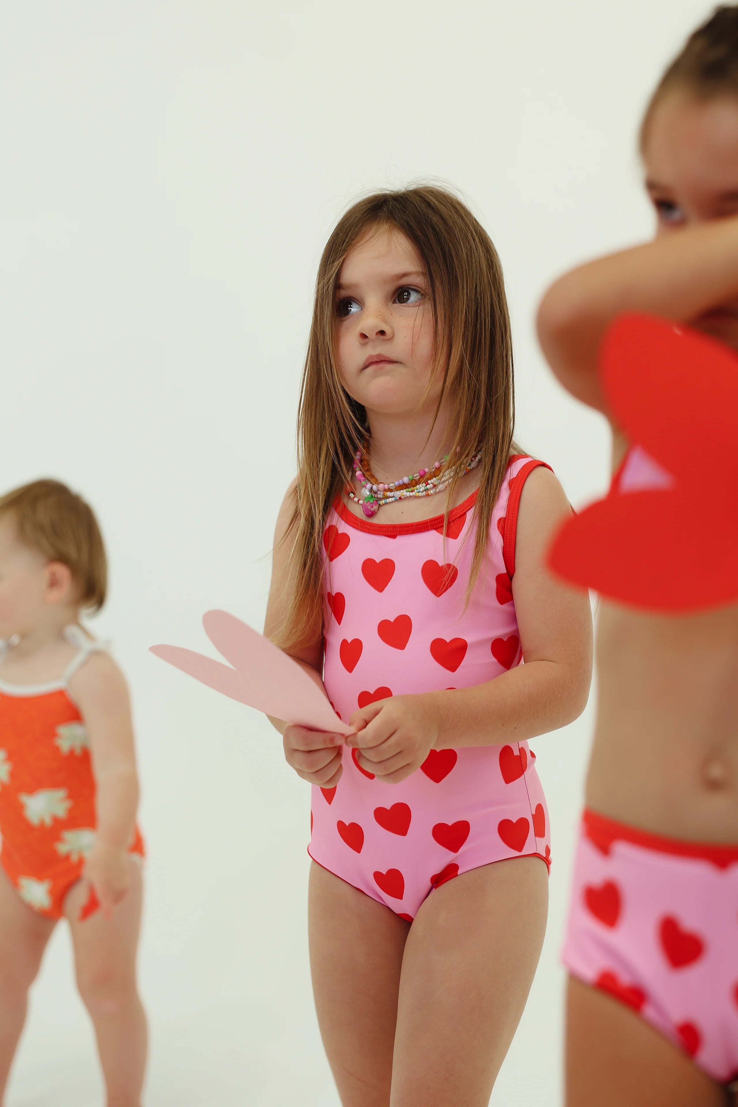 girls one piece swimsuit by By Billie - 'Love You' - pink with red hearts