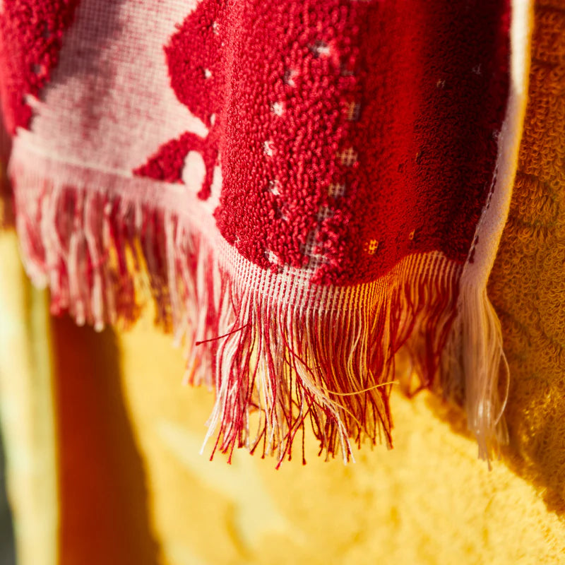 fringe detail on Lucia Bath Sheet crimson by Sage & Clare