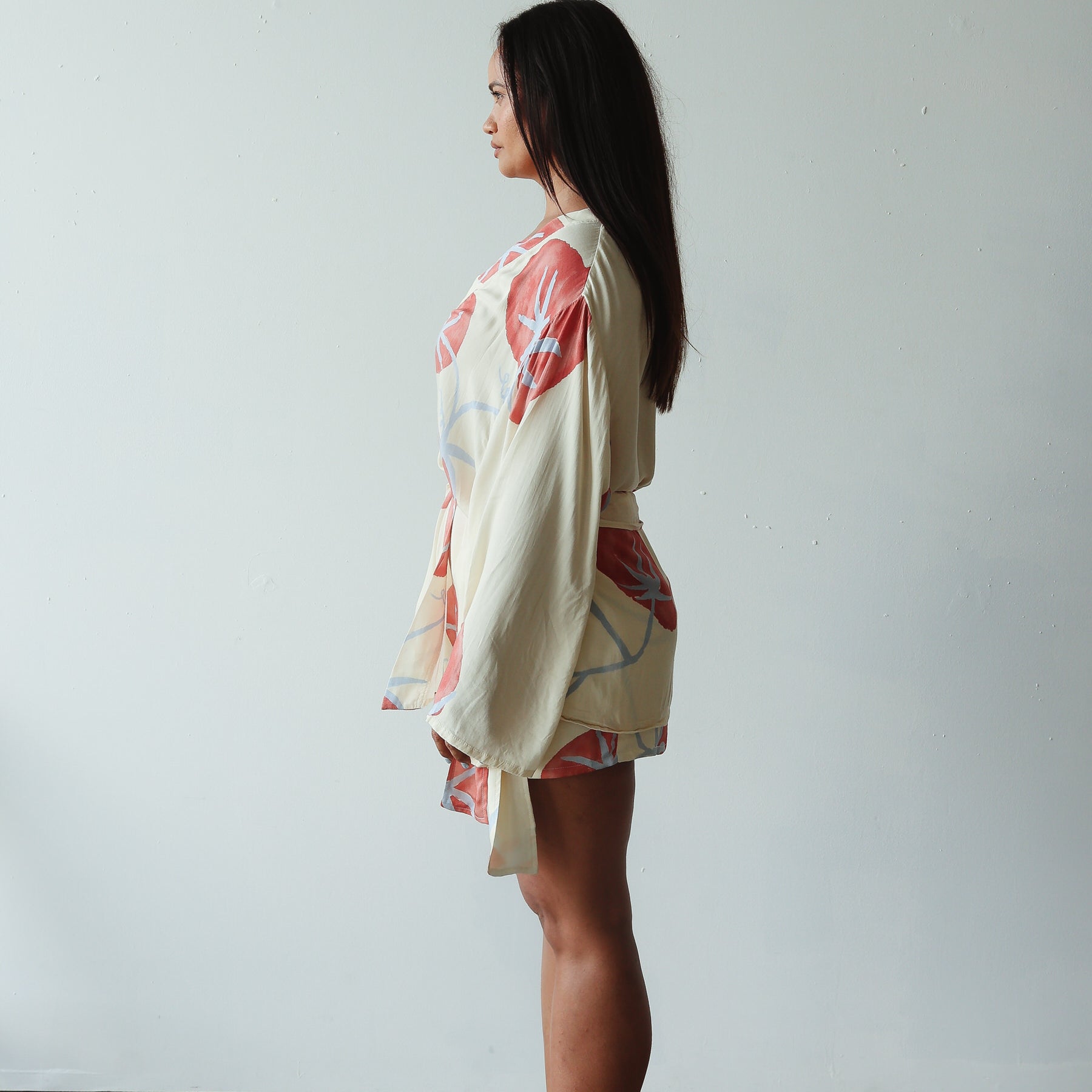side view of model wearing Luella Kimono - Tomato Print by By Billie