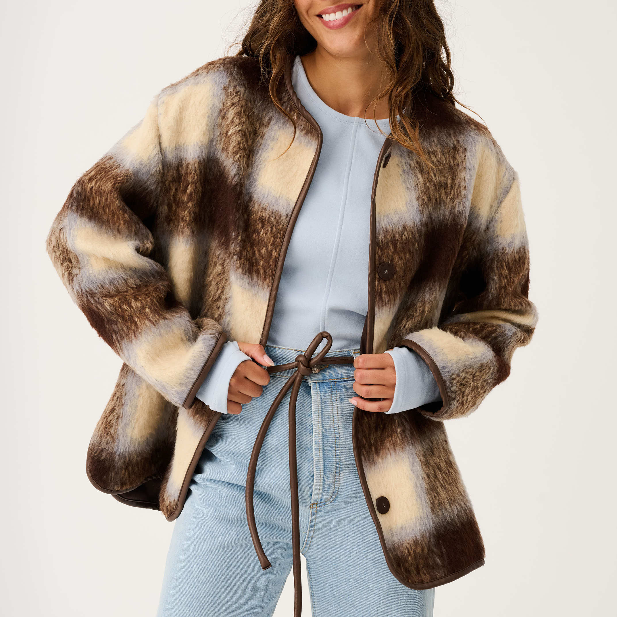 Open front styling of Luka Jacket with check pattern and brown leather tie belt details
