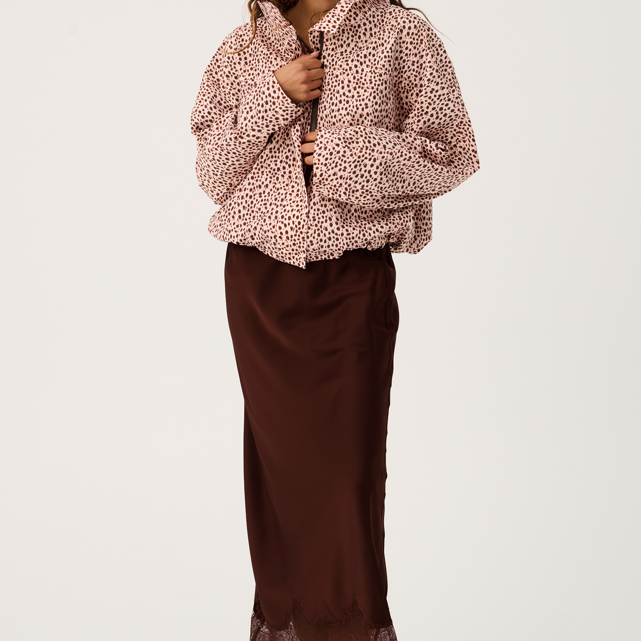 Front view of Luna Skirt in truffle brown featuring midi length cut and intricate lace trim hemline