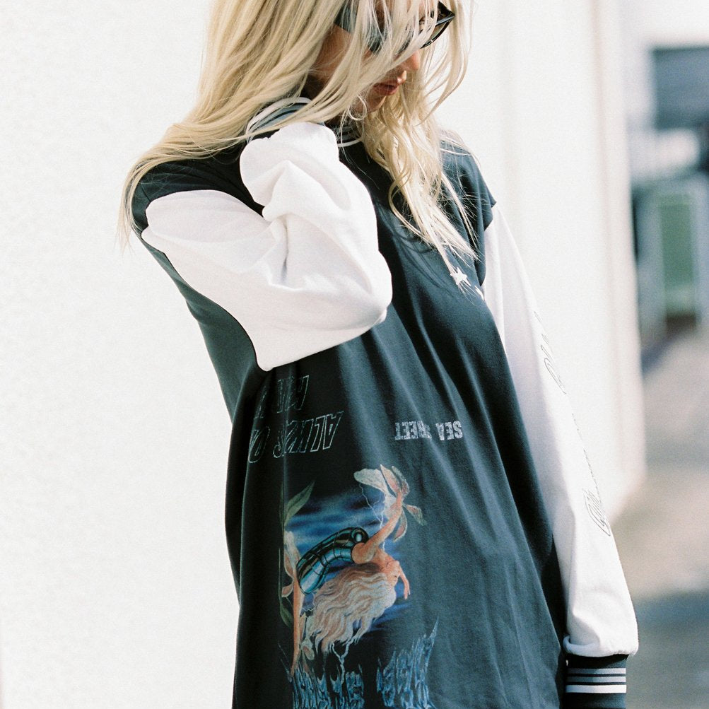 Model wearing Sea Street Metallic Diver Long Sleeve with graphic print and white contrast sleeves