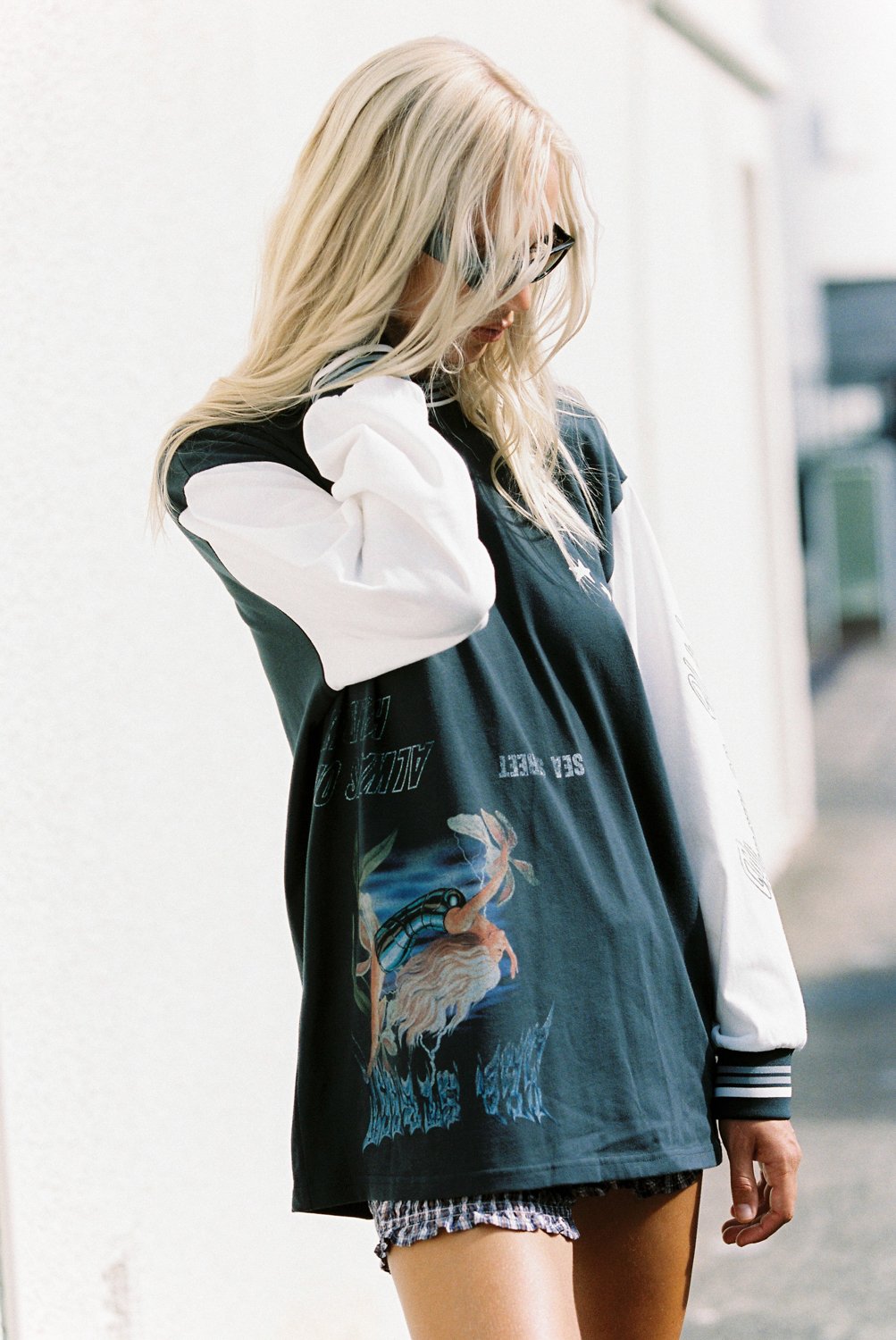 Model wearing Sea Street Metallic Diver Long Sleeve with graphic print and white contrast sleeves
