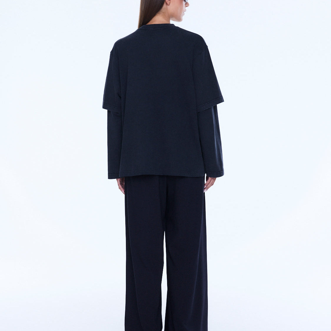 Back view of Mock Layer Long Sleeve Tee showing plain vintage black rear design and layered construction